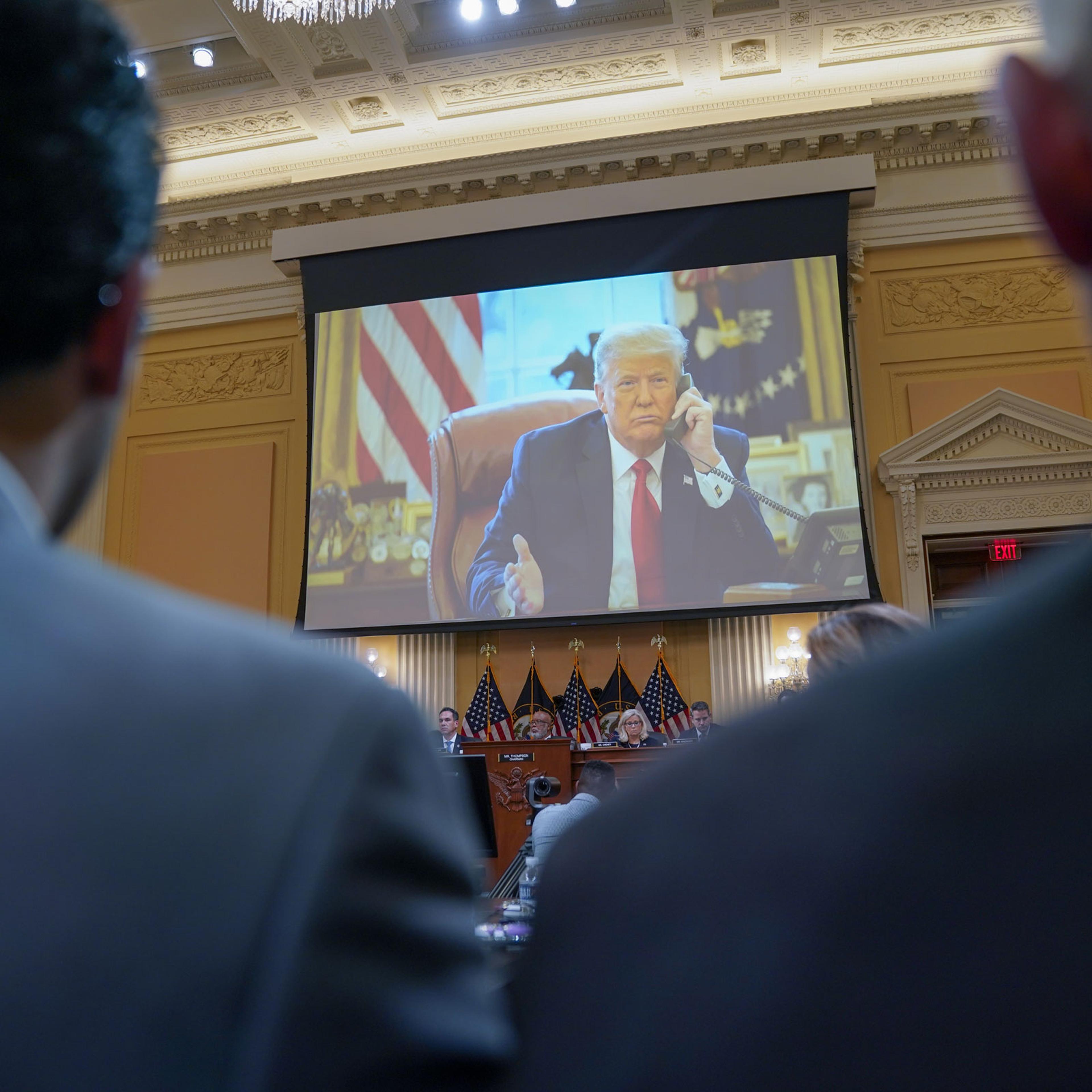Photos of then-President Trump are shown during a House Select Committee to Investigate the January 6th hearing
