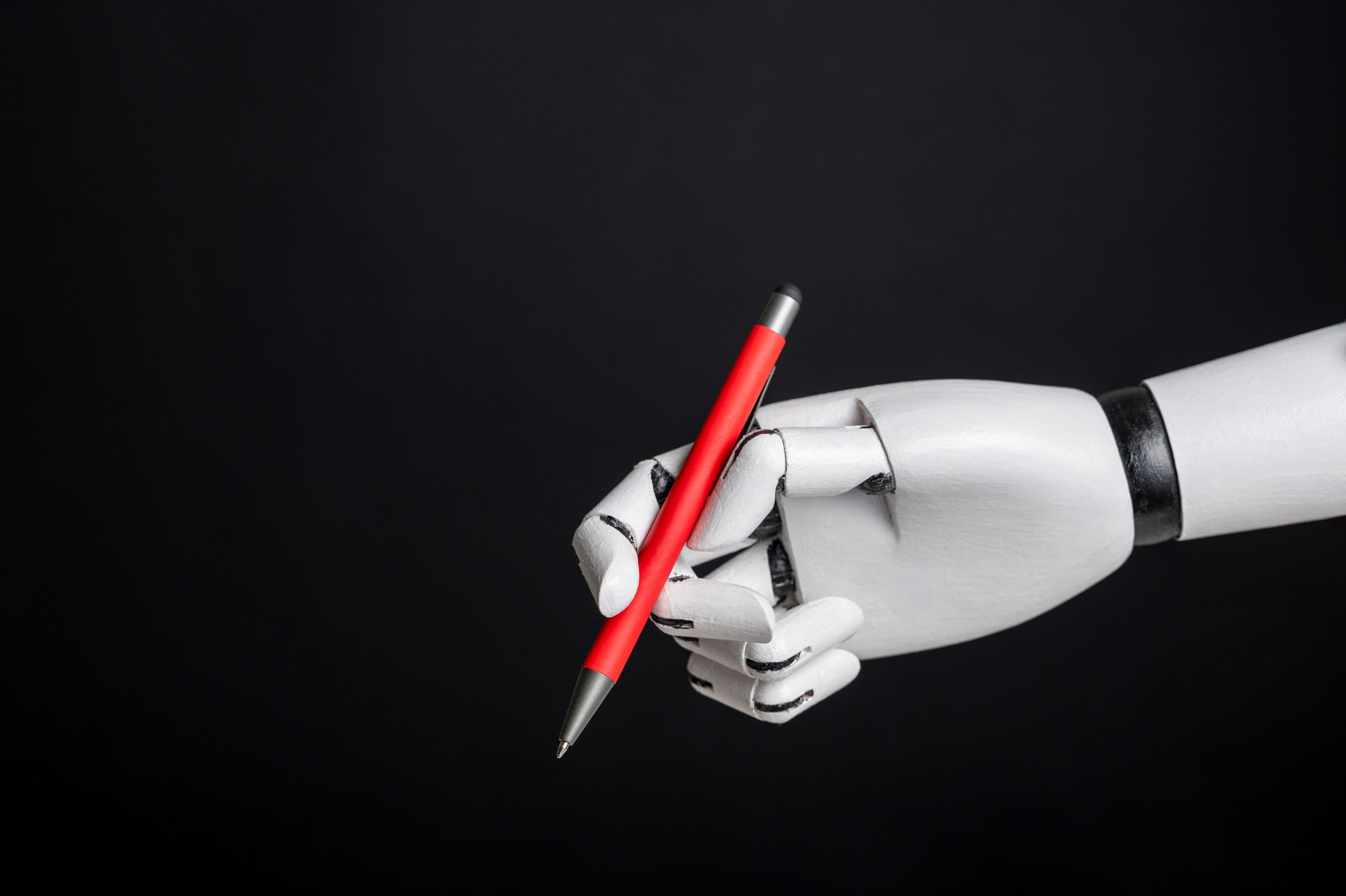 Robotic hand holding pen