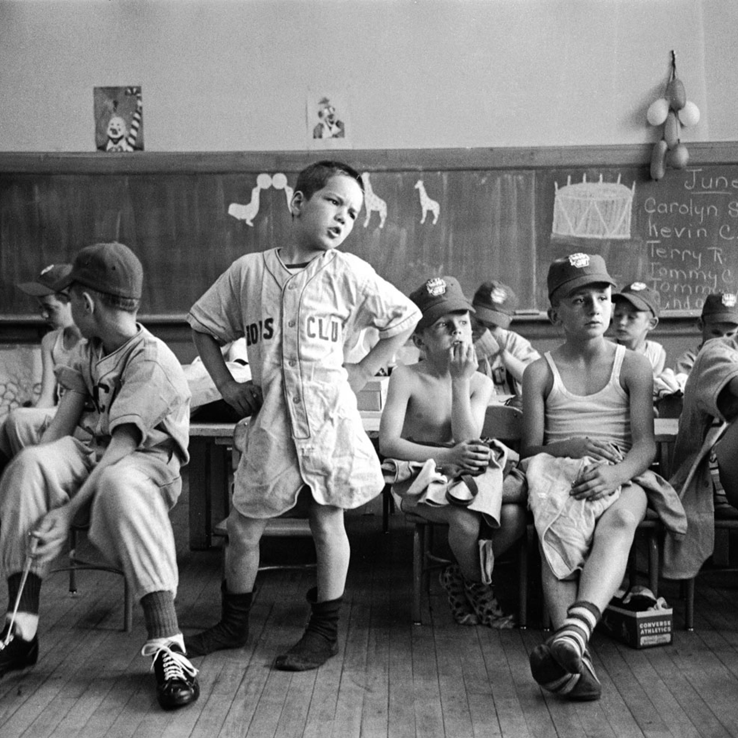 Little Leaguers (including their formidable leader, Dick Williams, center), await missing parts of their uniforms, Manchester, N.H., 1954.