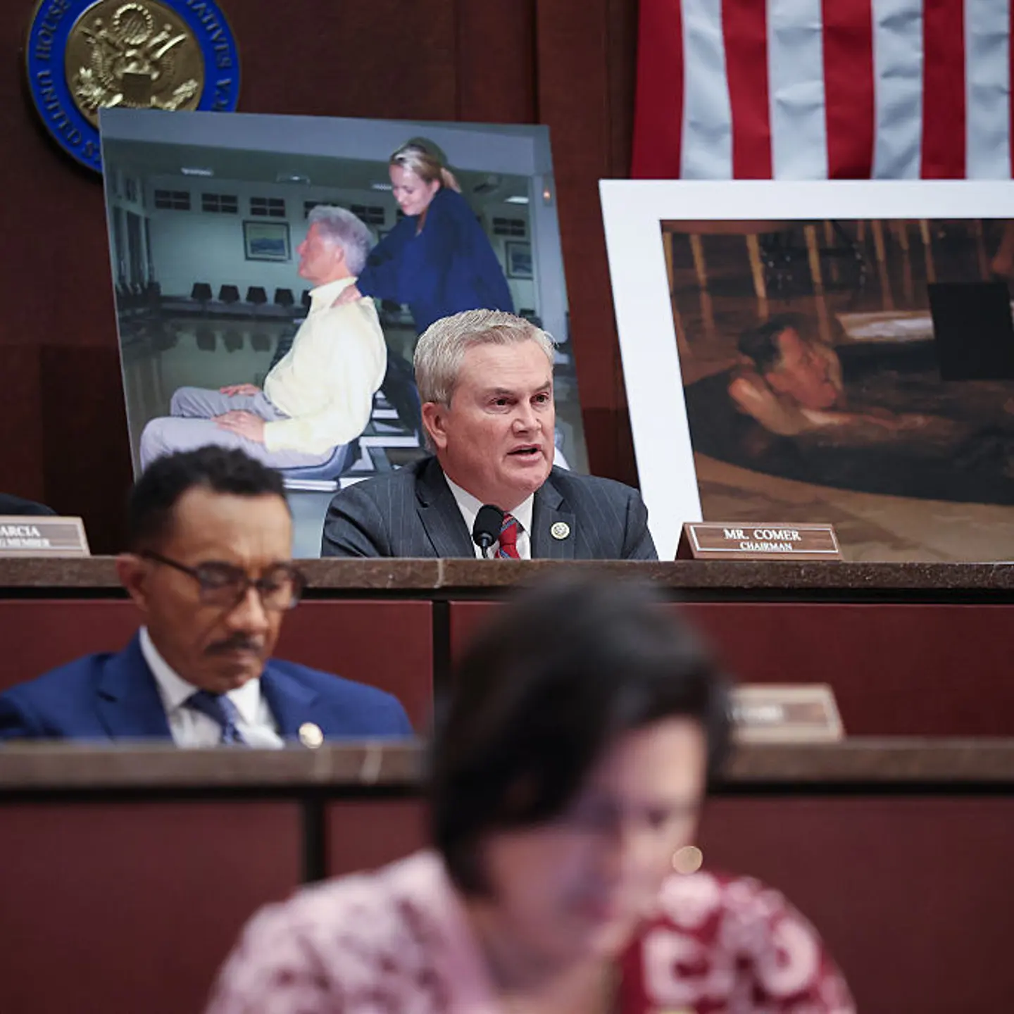 With photographs of former President Bill Clinton behind him, House Oversight and Government Reform Committee Chairman Rep. James Comer (R, Ky.) speaks during a hearing at the U.S. Capitol in Washington, D.C., on Jan. 21, 2026.