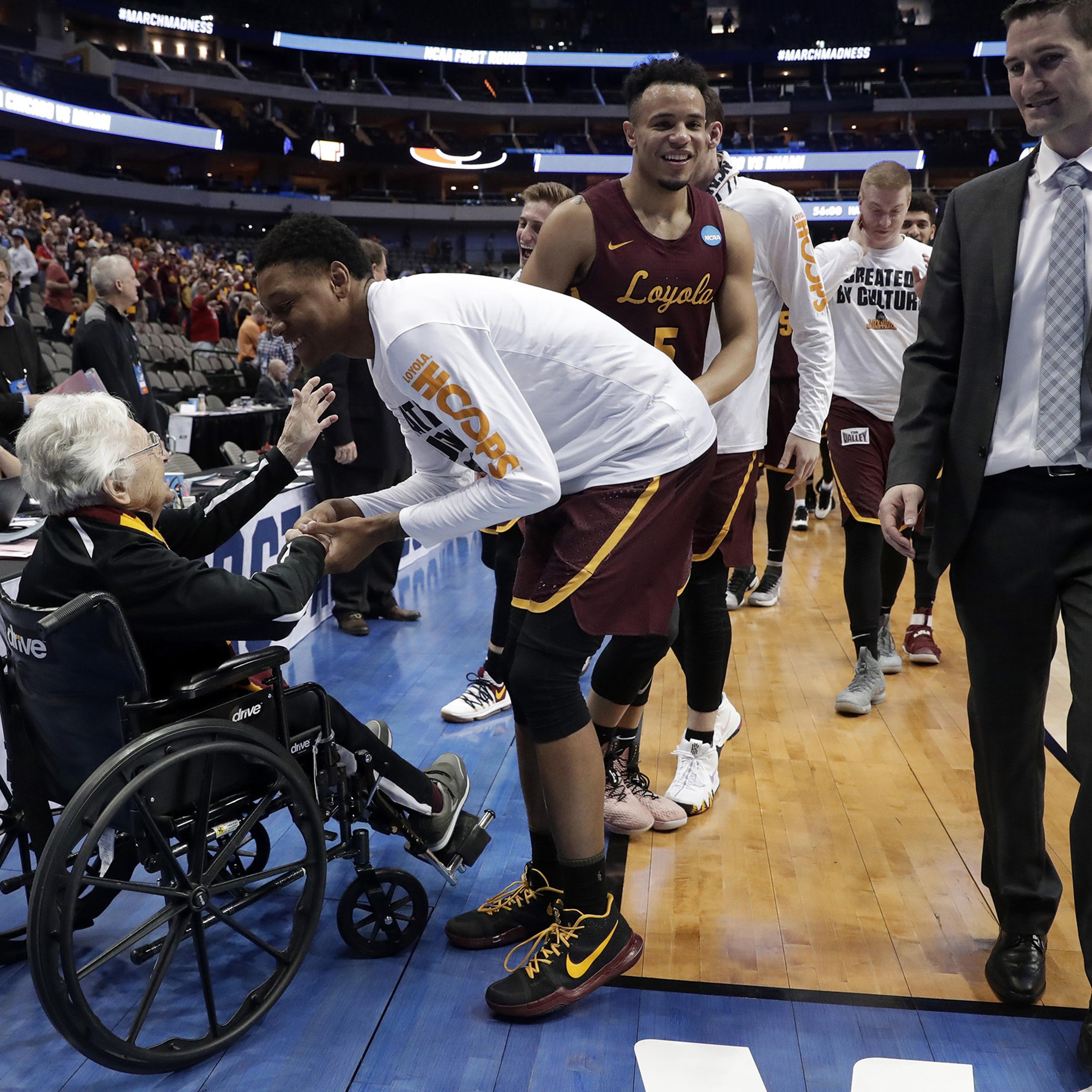 Sister Jean, the 98-year-old team chaplain for Loyola-Chicago, greets players after a win