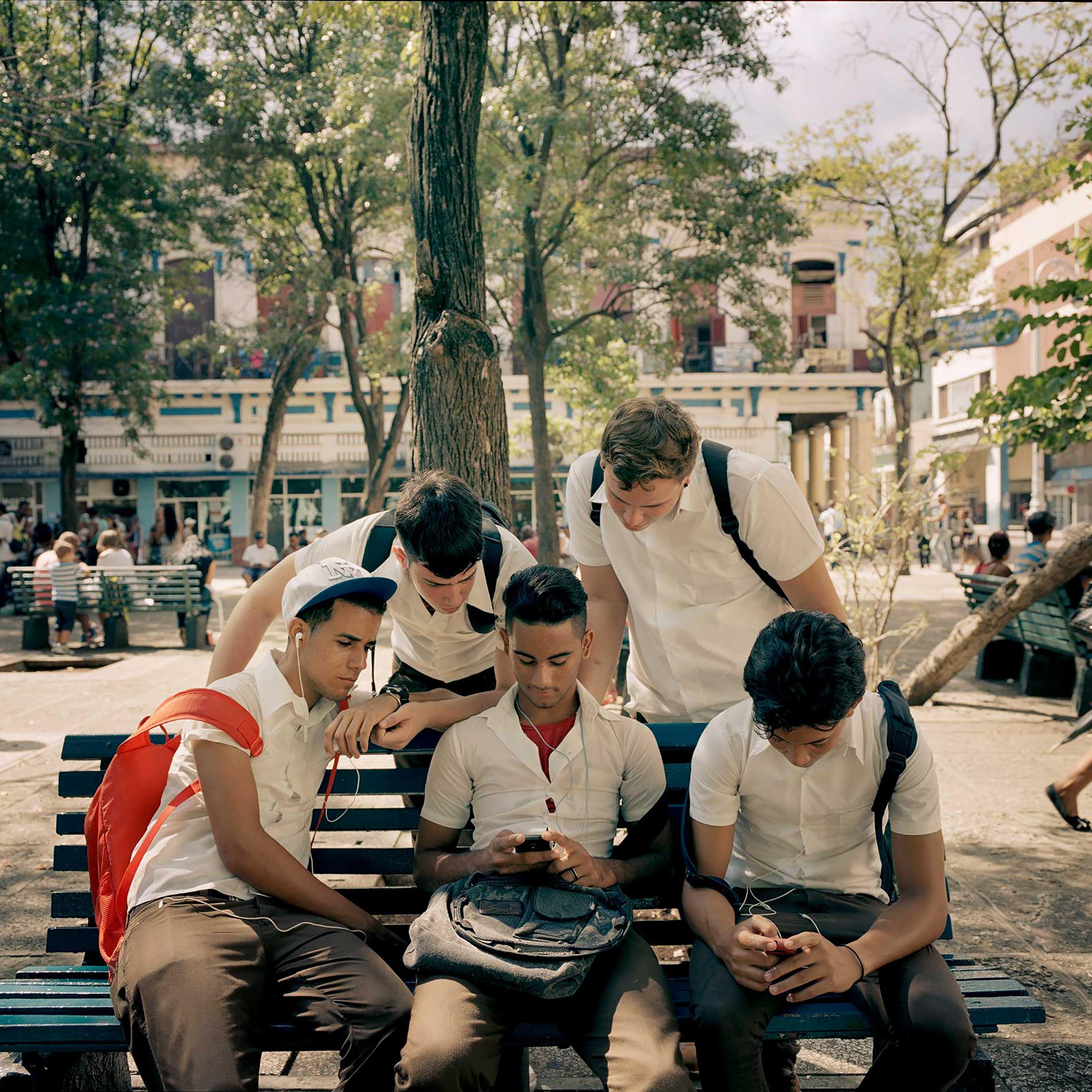 Young people gather at a Havana city park, where there is a Wi-Fi hotspot.