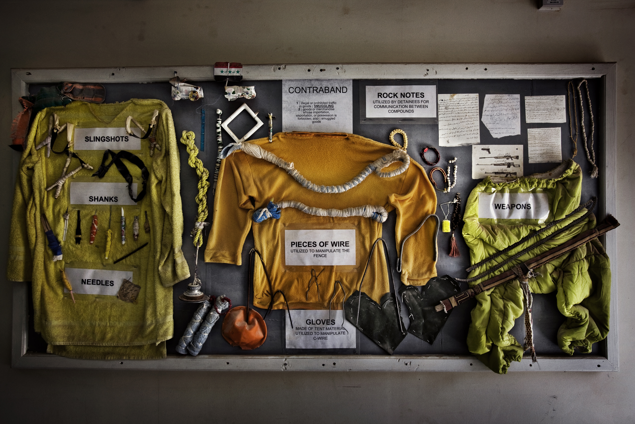 A bulletin board at Camp Cropper, the second largest U.S. military detention facility in Iraq, displaying makeshift weapons and other contraband confiscated from the Iraqi detainees, Baghdad, Iraq, July 26, 2008.