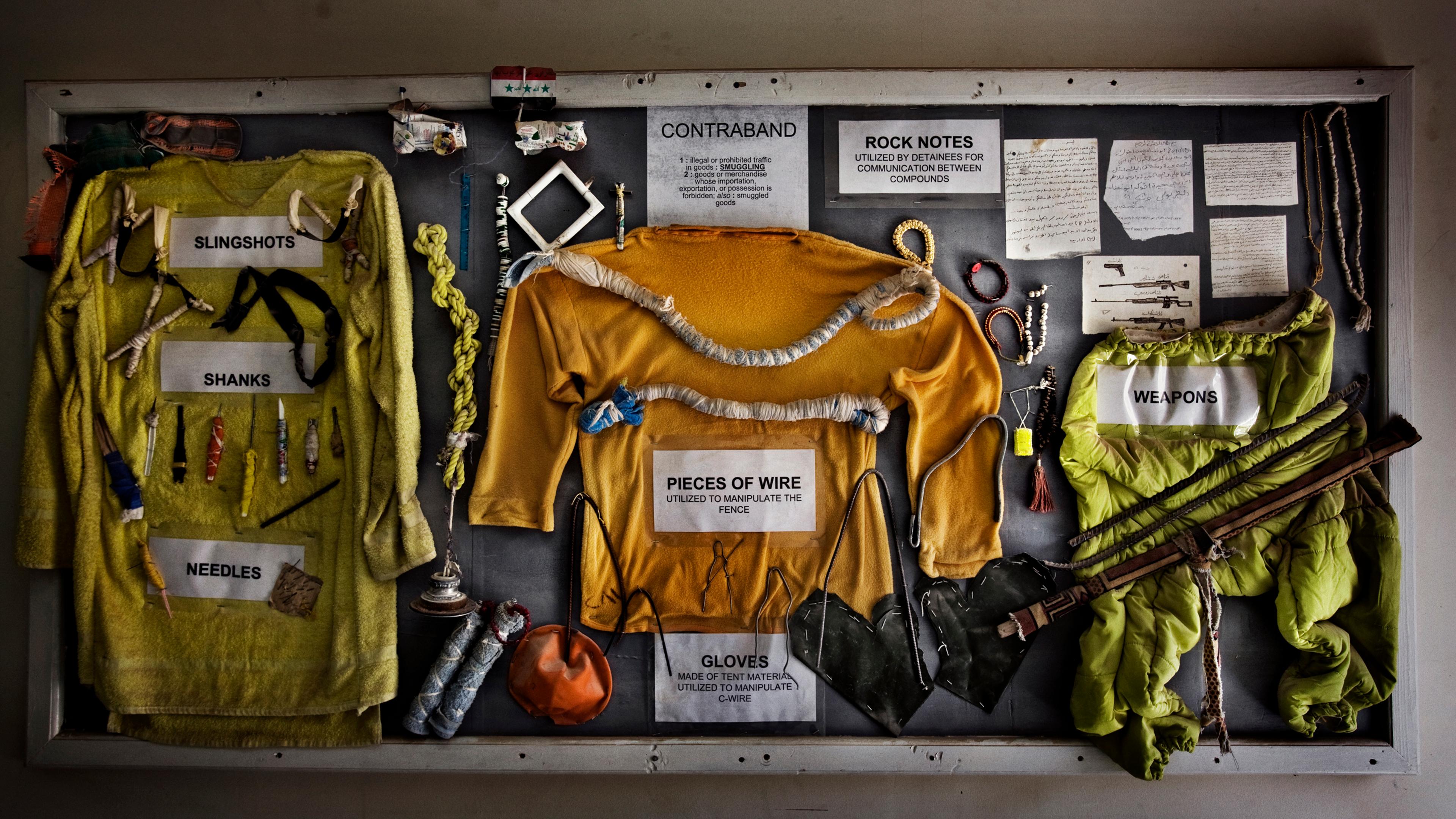 A bulletin board at Camp Cropper, the second largest U.S. military detention facility in Iraq, displaying makeshift weapons and other contraband confiscated from the Iraqi detainees, Baghdad, Iraq, July 26, 2008.