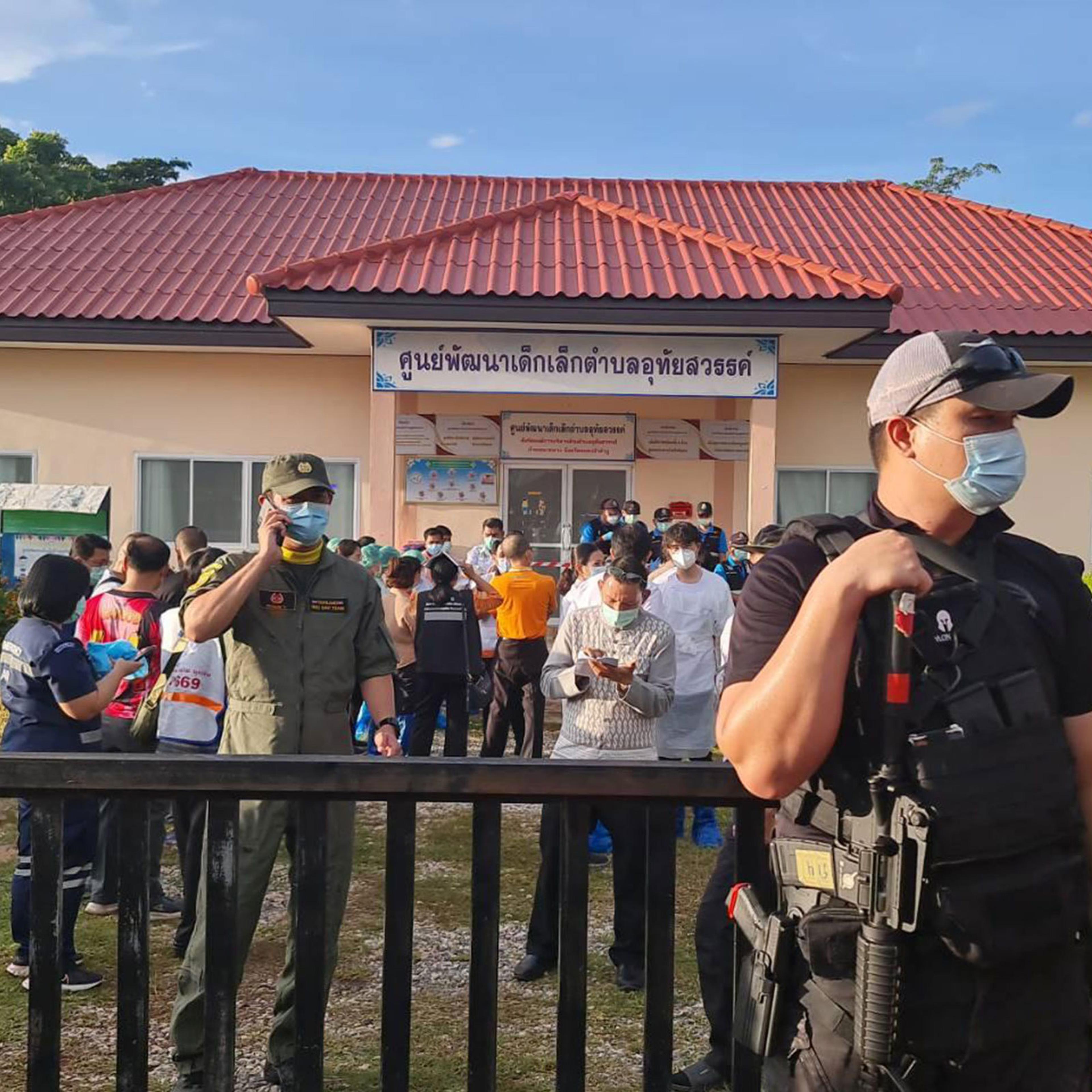 A police officer stands guard at the childcare center where a shooting took place in Nong Bua Lamphu province, Thailand, on Oct. 6, 2022.