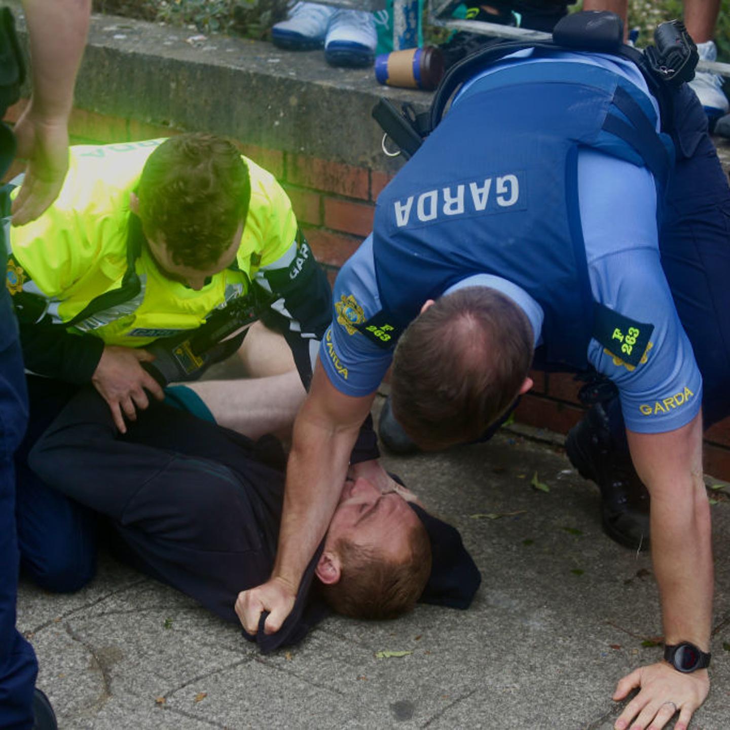 Ireland police department Gardai arrest an anti-immigration protester as demonstrators gather at a site designated for asylum seekers in Coolock, North Dublin, Ireland on July 15, 2024.
