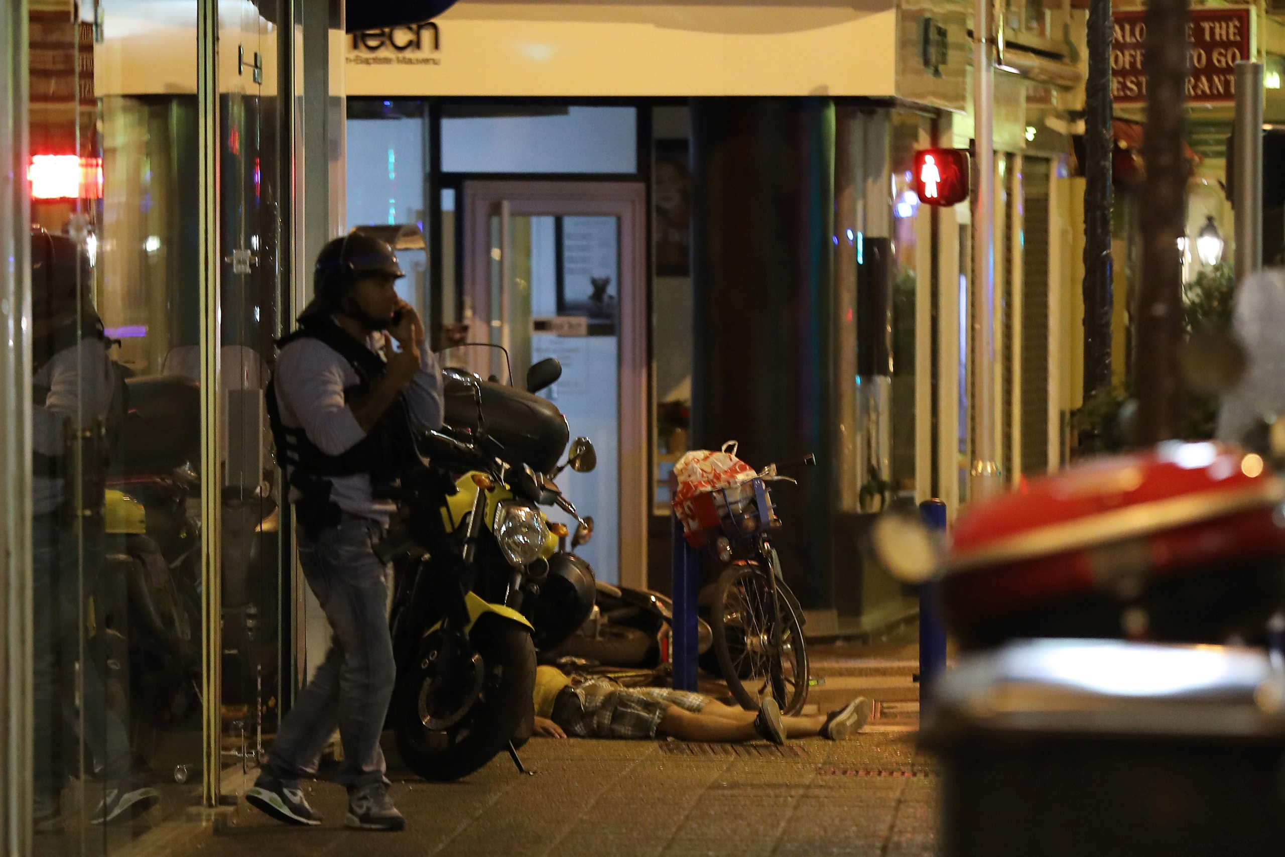 A dead body lies on the ground on July 15, 2016, after authorities said a van drove into a crowd watching a fireworks display in the French Riviera town of Nice.