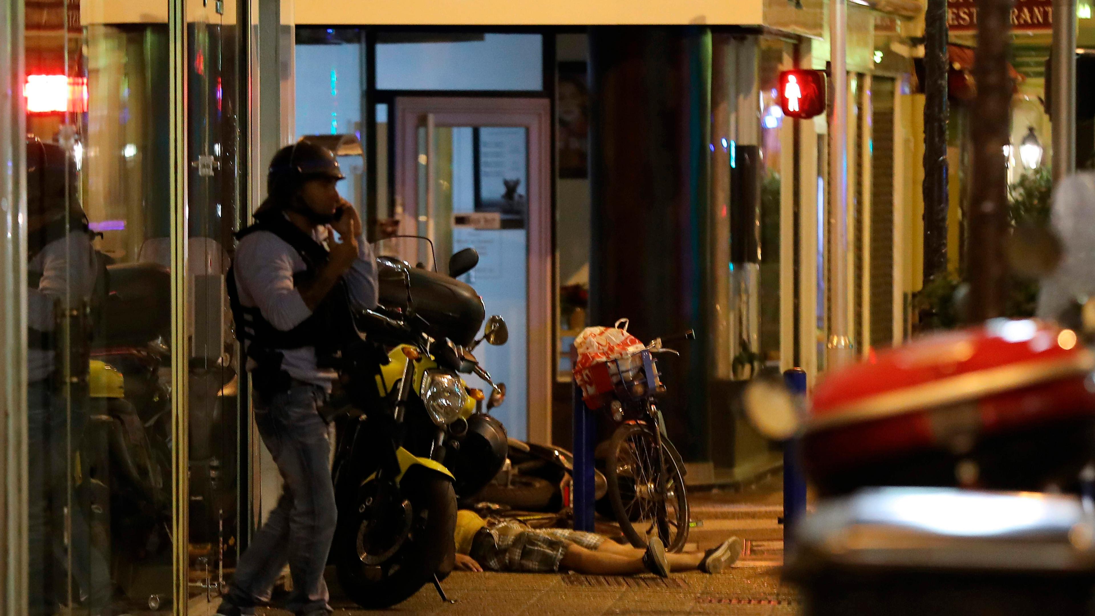 A dead body lies on the ground on July 15, 2016, after authorities said a van drove into a crowd watching a fireworks display in the French Riviera town of Nice.