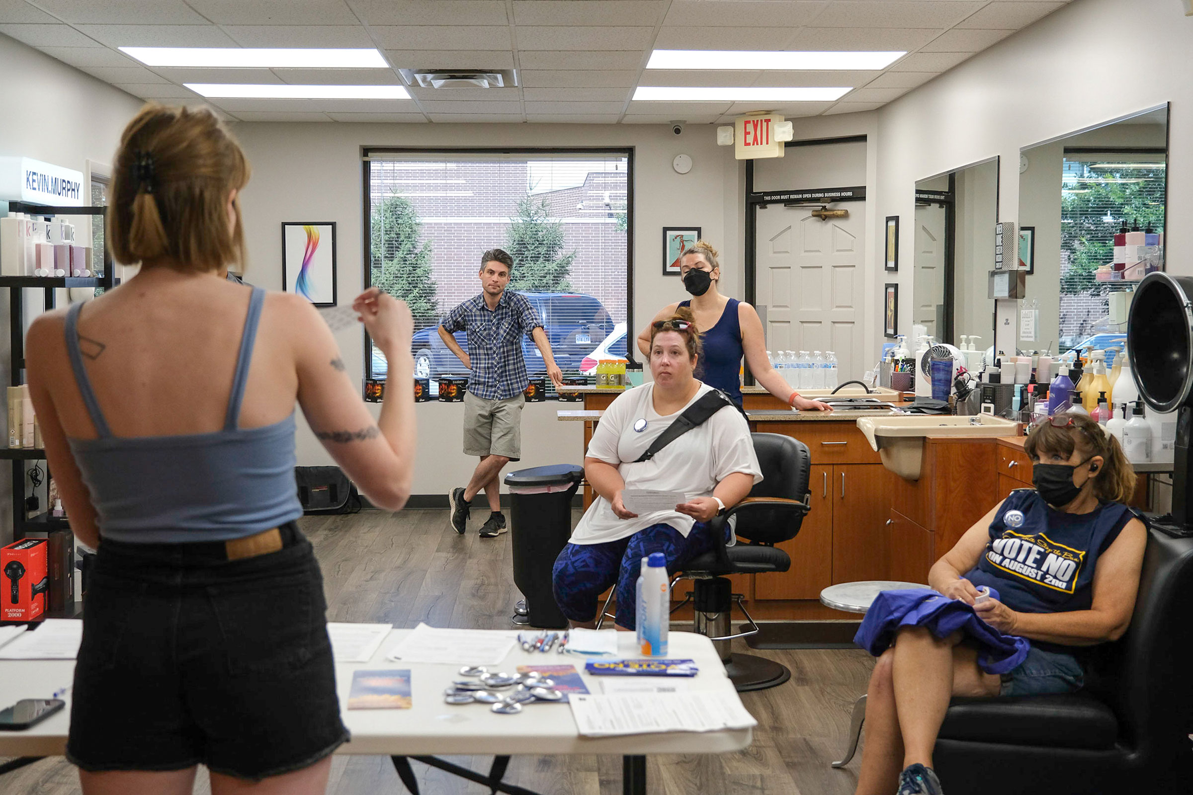 Jae Gray of Kansans for Constitutional Freedom leads a cavassing training session in Overland Park, Kansas on July 23, 2022. Arin Yoon for TIME.