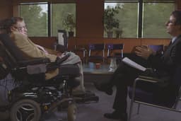 Oliver, at right, interviews Stephen Hawking
