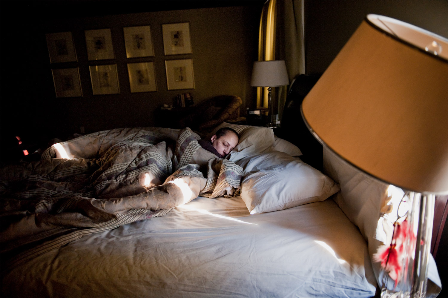 Recovering from months of surgery, chemotherapy and radiation treatments, Laurel Borowick rests in her bedroom in Westchester, New York, February 2010. 