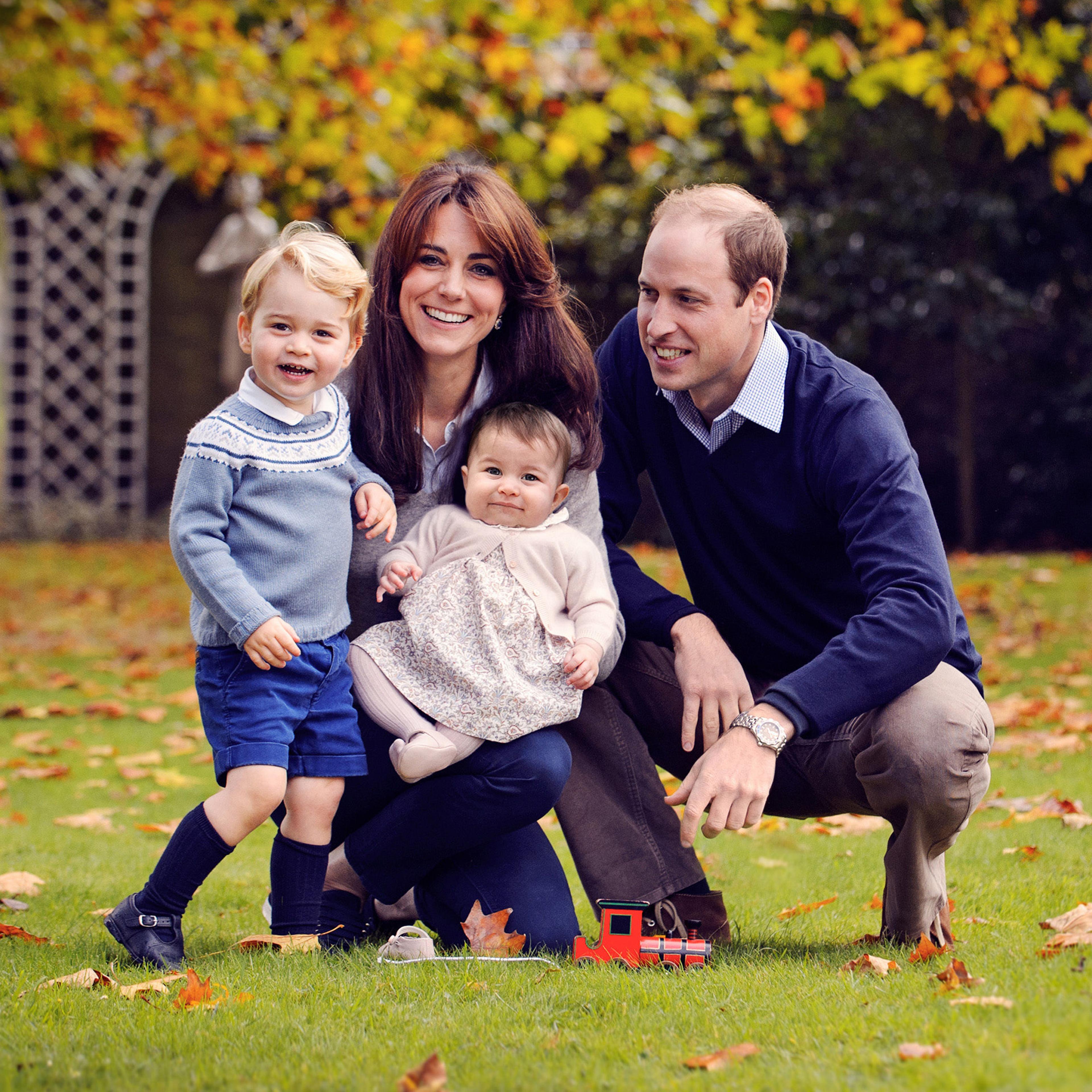 The Duke and Duchess of Cambridge with their two children, Prince George and Princess Charlotte, at Kensington Palace in London, Dec. 29, 2015.