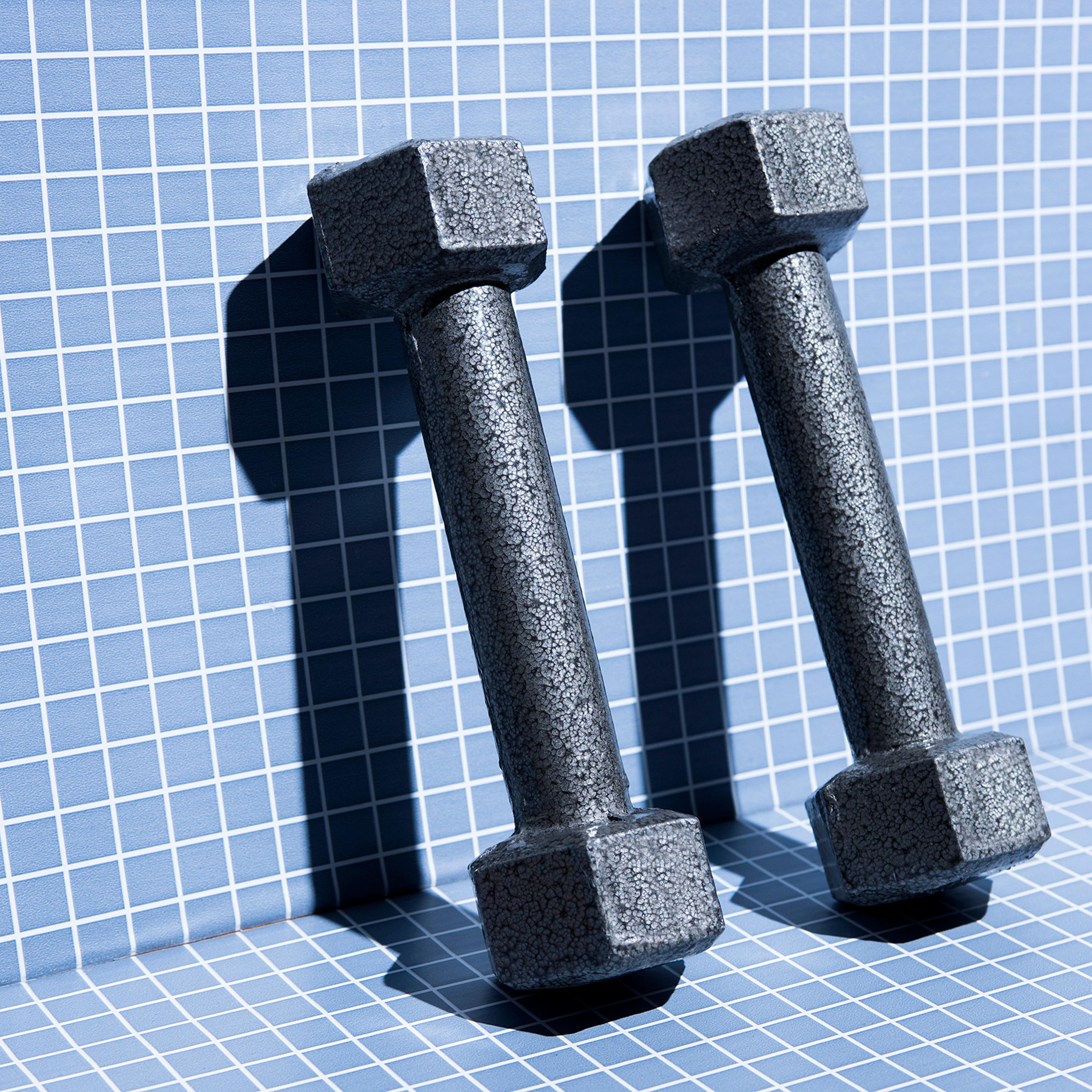 metal-weights-4-fitness-exercise-strength-health-betterment-body-image-motto-stock