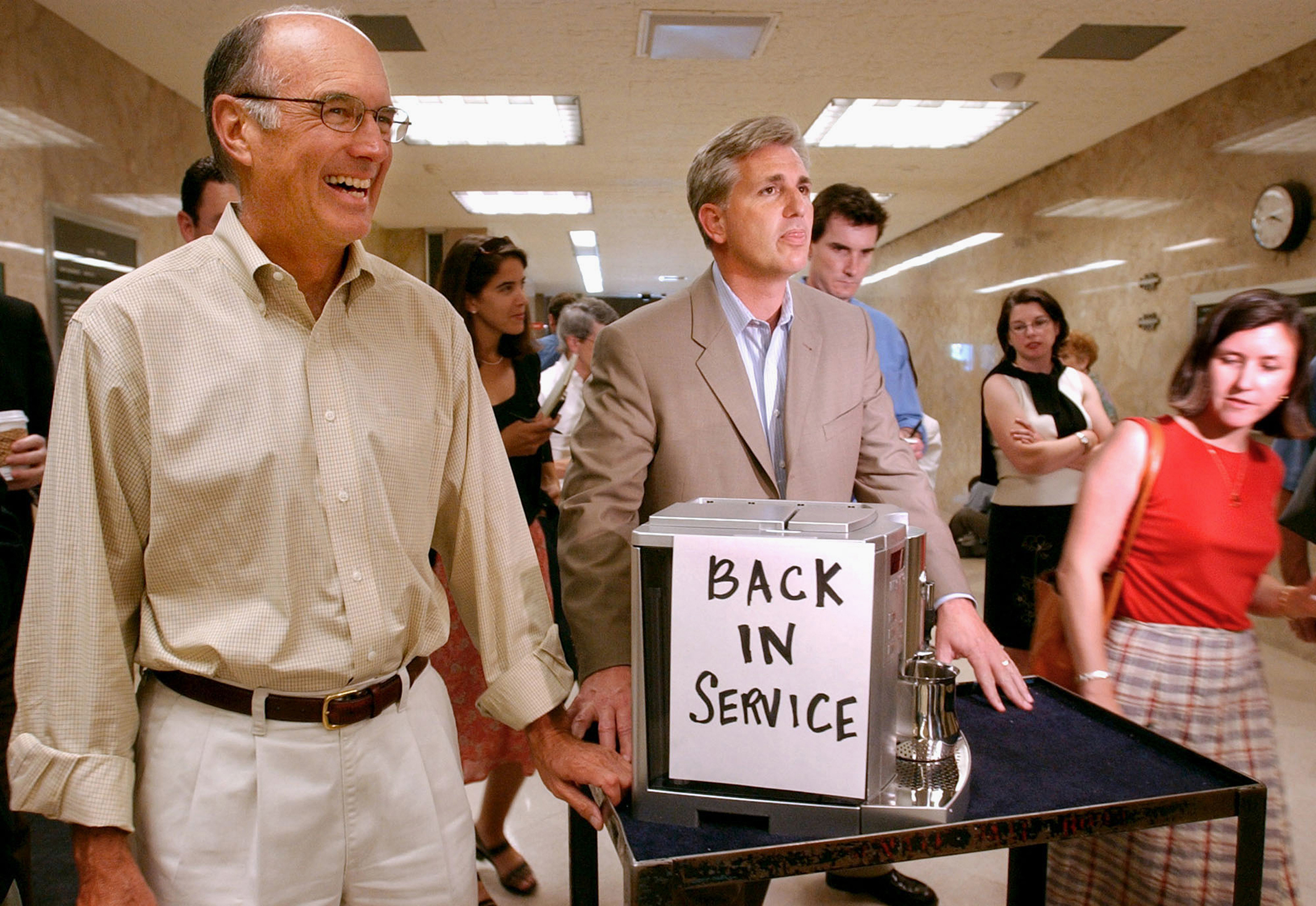 In this July 20, 2004 photo, then-California Assembly Republican Leader Kevin McCarthy, center, and Senate Republican Leader Dick Ackerman, left, wheel a cappuccino machine into the Governor's office at the Capitol in Sacramento. McCarthy, the majority l