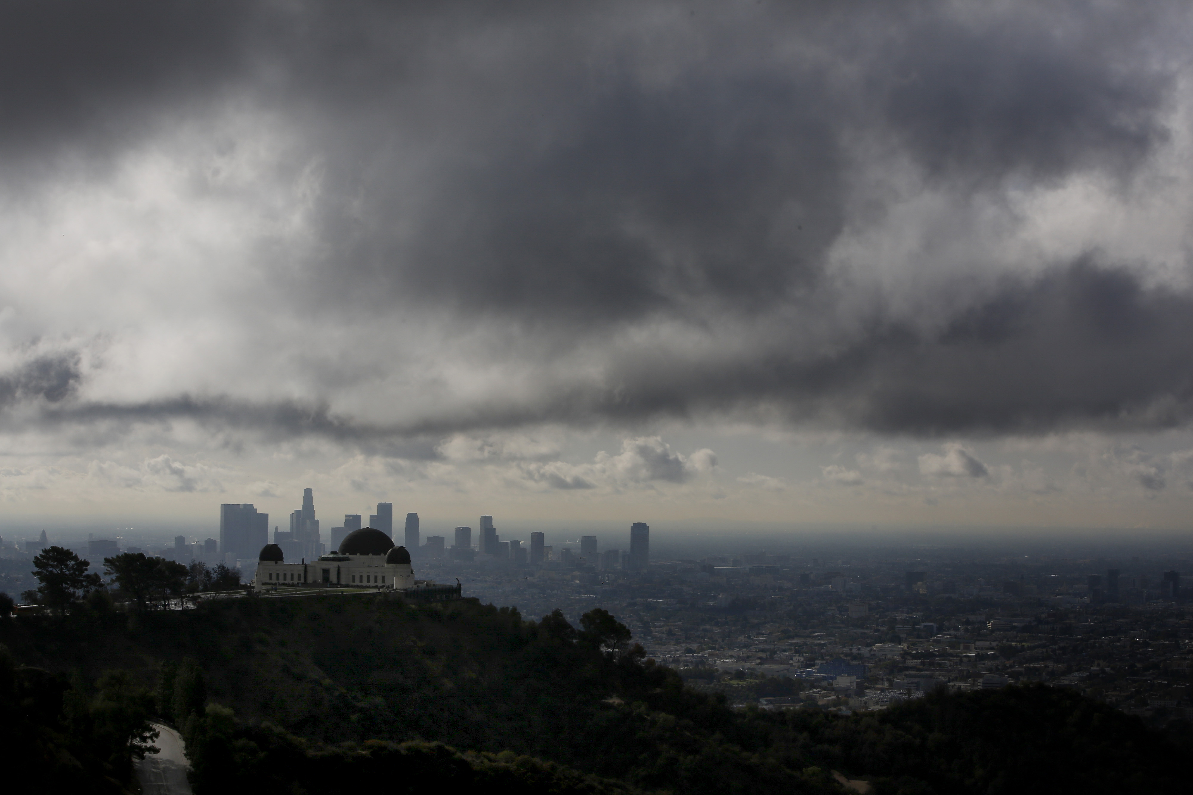 The Griffith Observatory is seen as clouds gather above the skyline of Downtown Los Angeles in Los Angeles, California, U.S., on Thursday, Feb. 27, 2014.