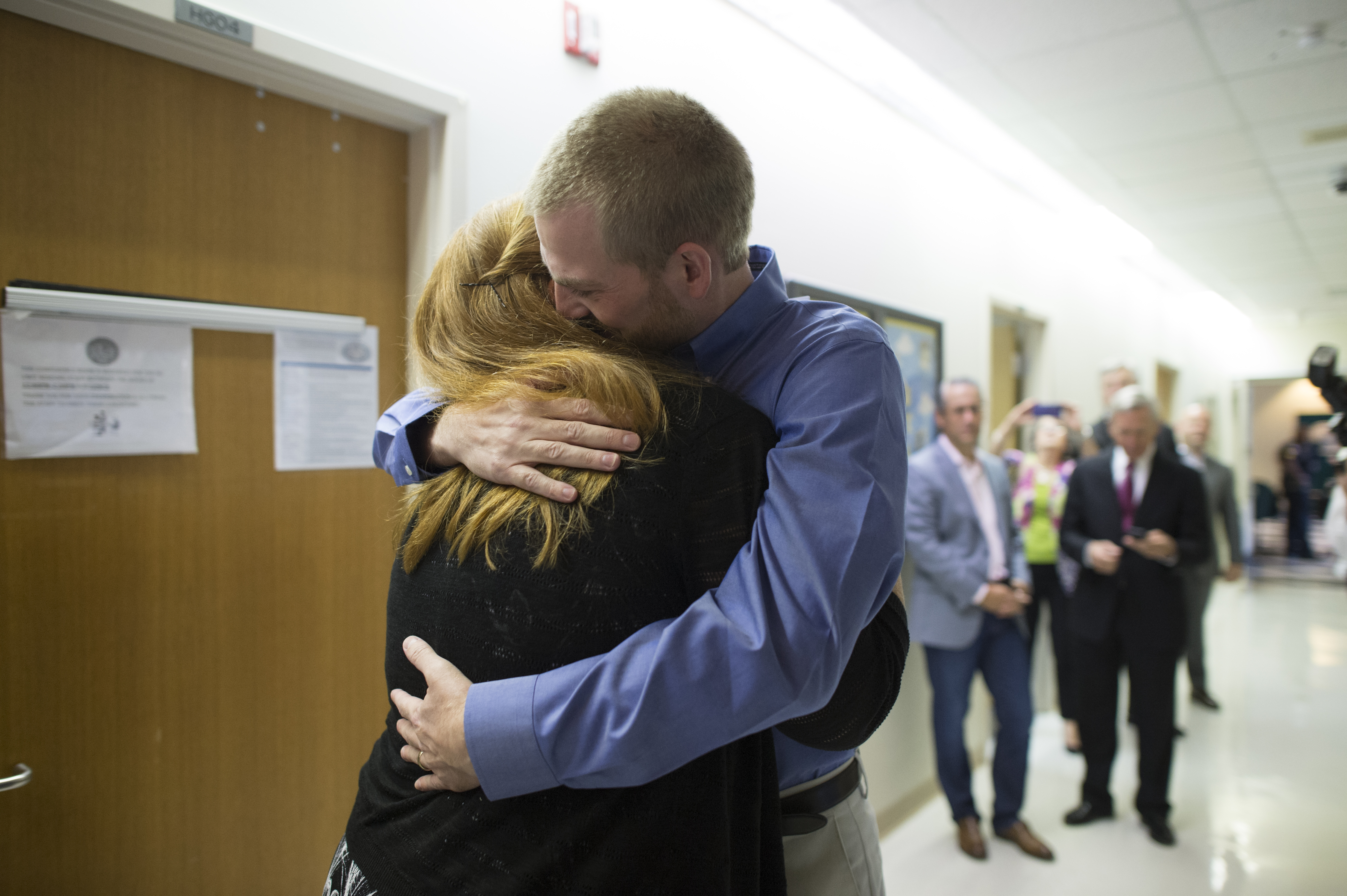 Dr. Kent Brantly hugs his wife Amber after being discharged from Emory University Hospital