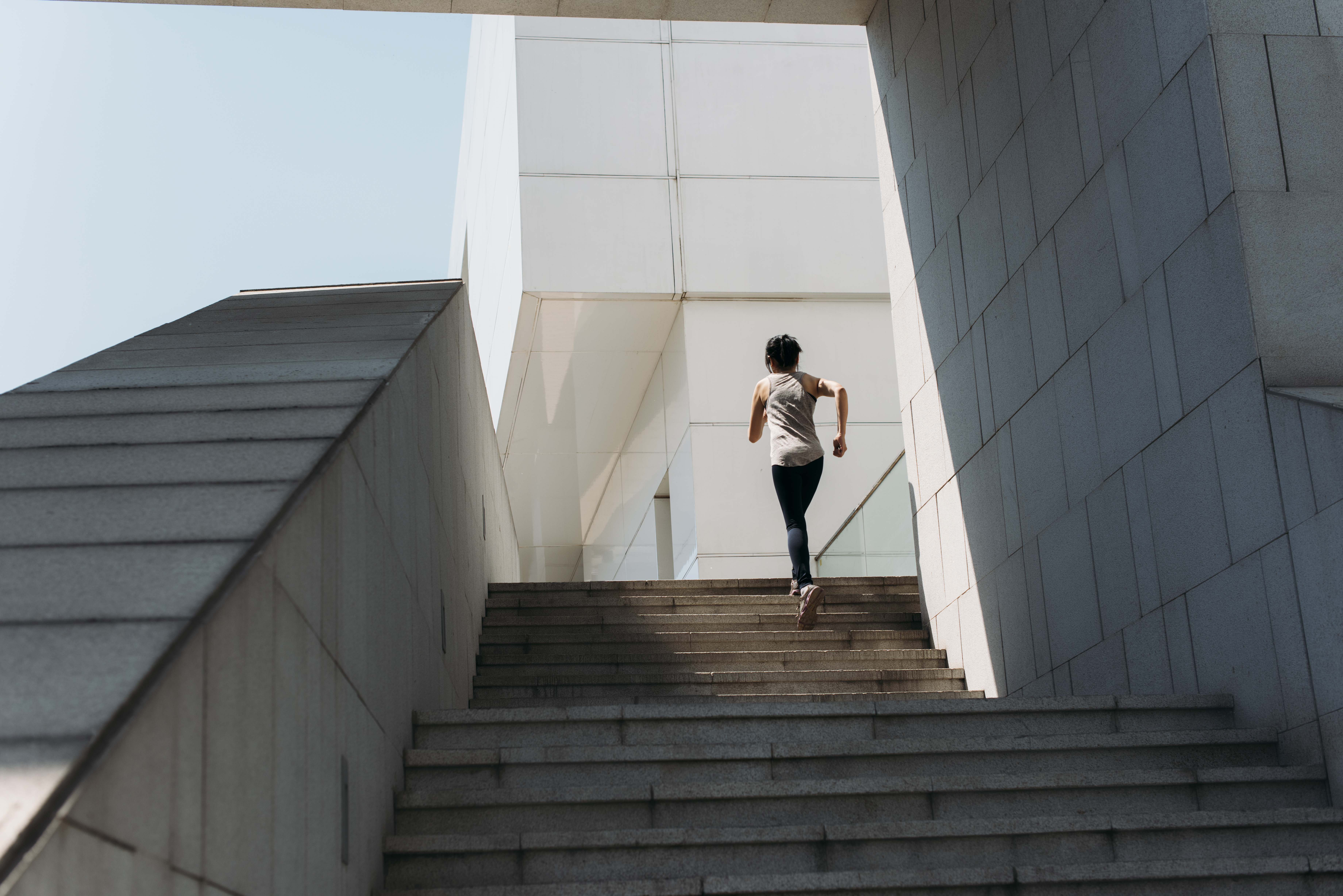 young woman running on the stairs