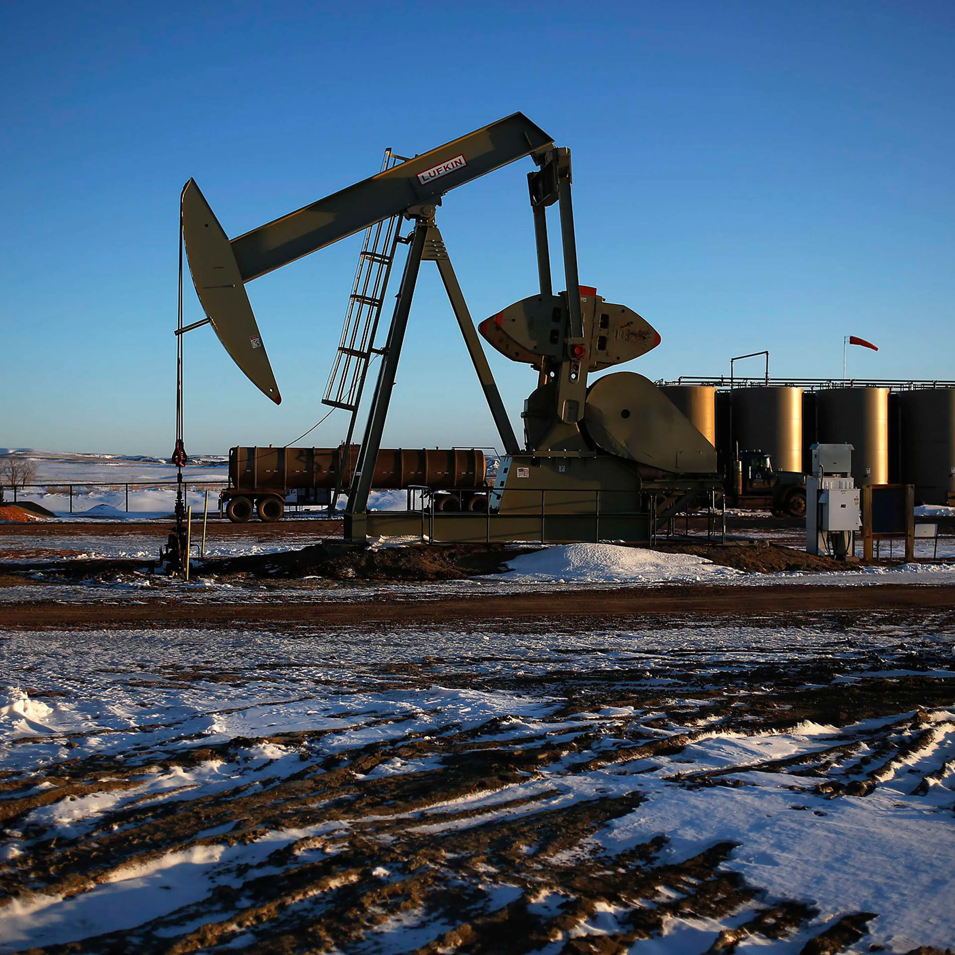 An oil drilling pump site is seen in McKenzie County outside of Williston, North Dakota