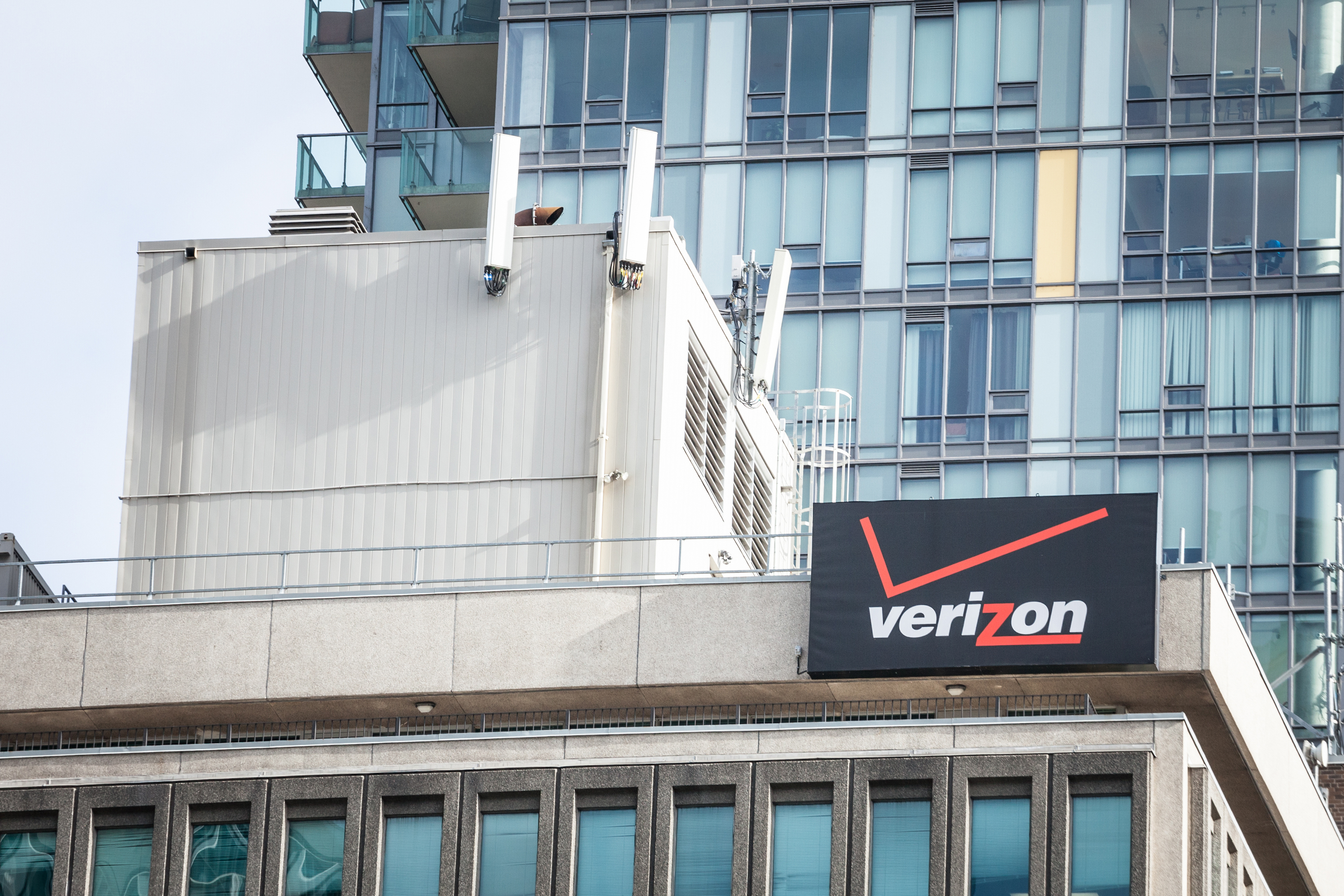 Verizon logo on their main office in Toronto, Ontario. Verizon is an american telecommunications and phone corporation, carrier and operator