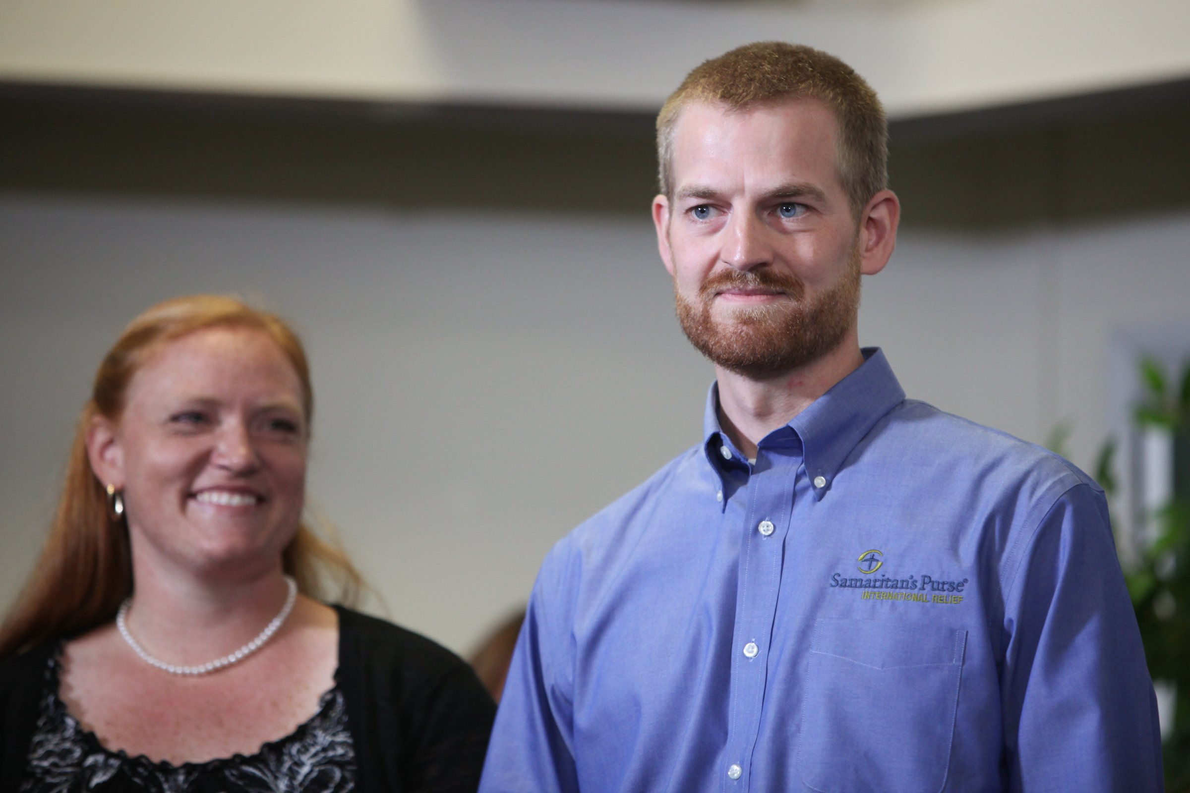 Dr. Kent Brantly an Ebola patient at Emory Hospital, stands with his wife, Amber Brantly, during a press conference announcing his release from the hospital on August 21, 2014 in Atlanta.