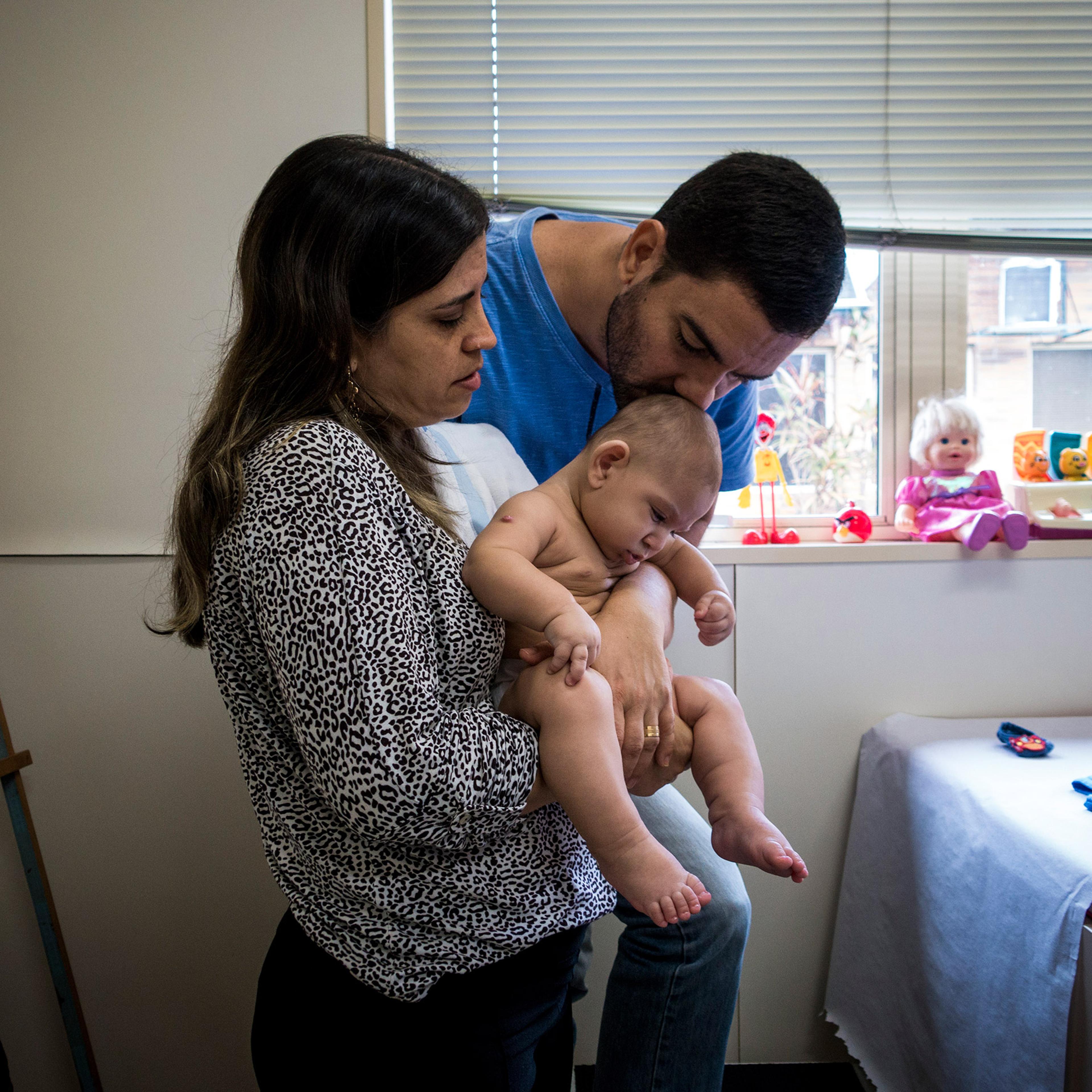 Isabel and Moises Albuquerque and their son son at the Associacao de Assistencia a Crianca Deficiente, a rehabilitation center for disabled children, in Recife, Brazil, Feb. 1, 2016.