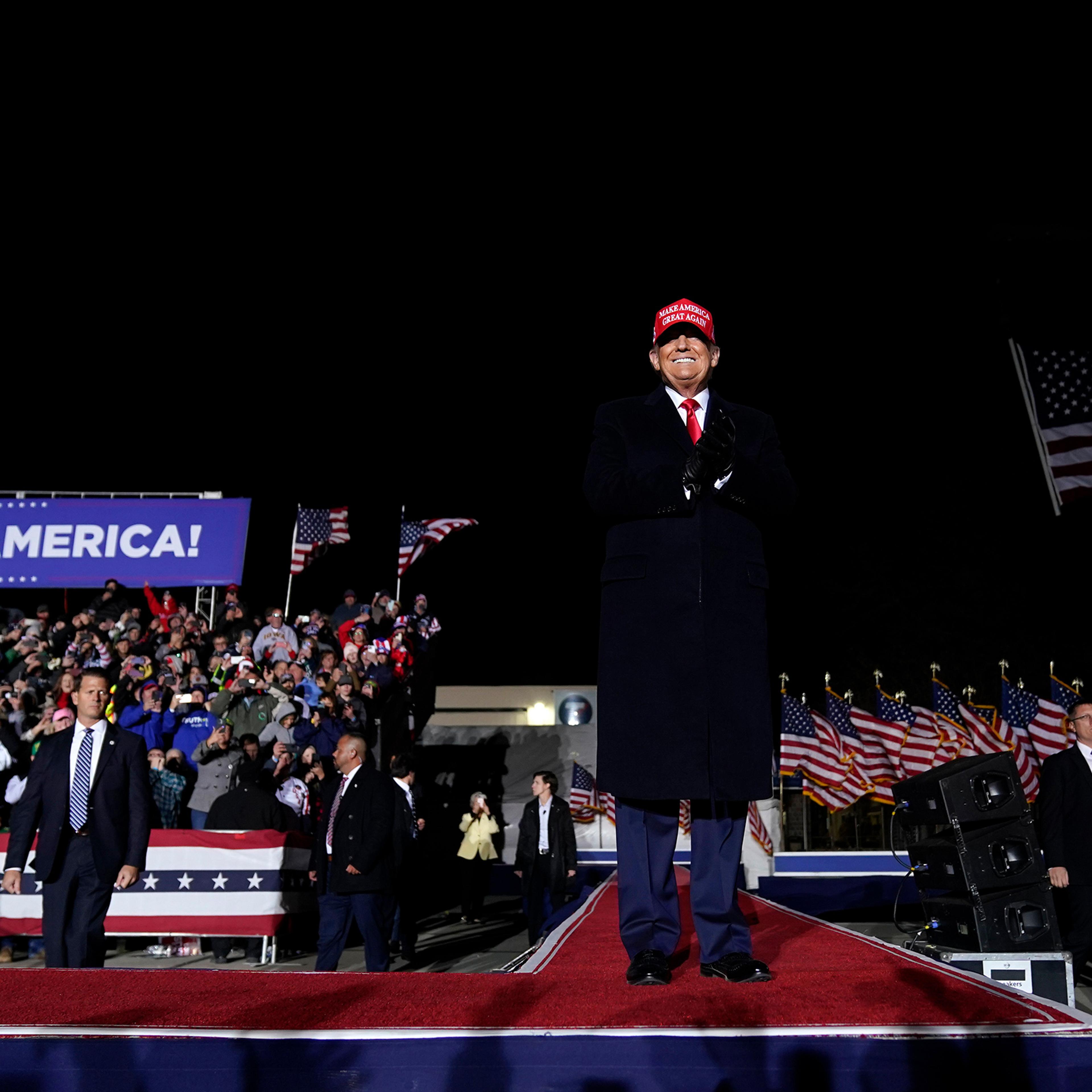 Former President Donald Trump arrives to speak at a rally in Sioux City, Iowa, Nov. 3, 2022.