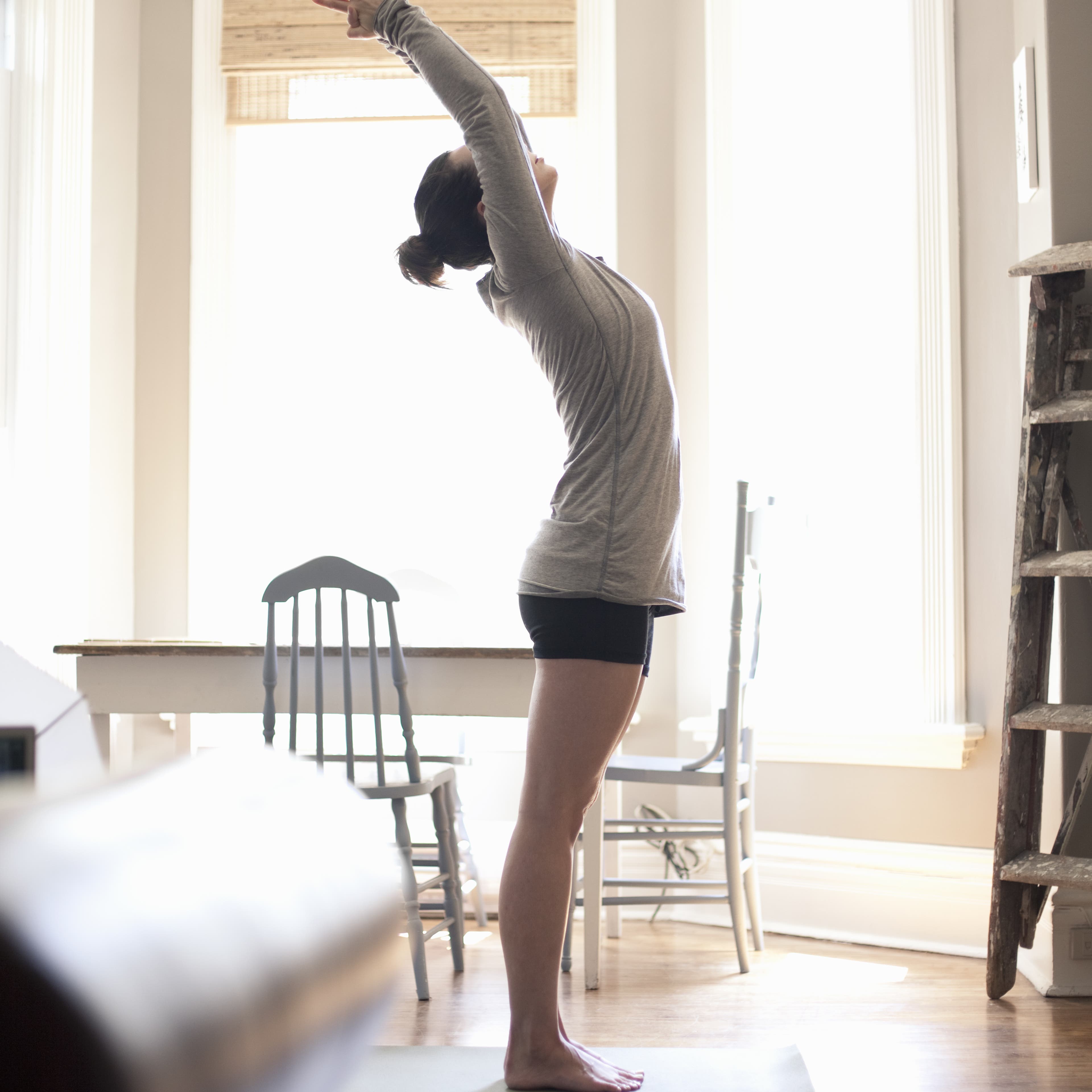 woman-stretching-home