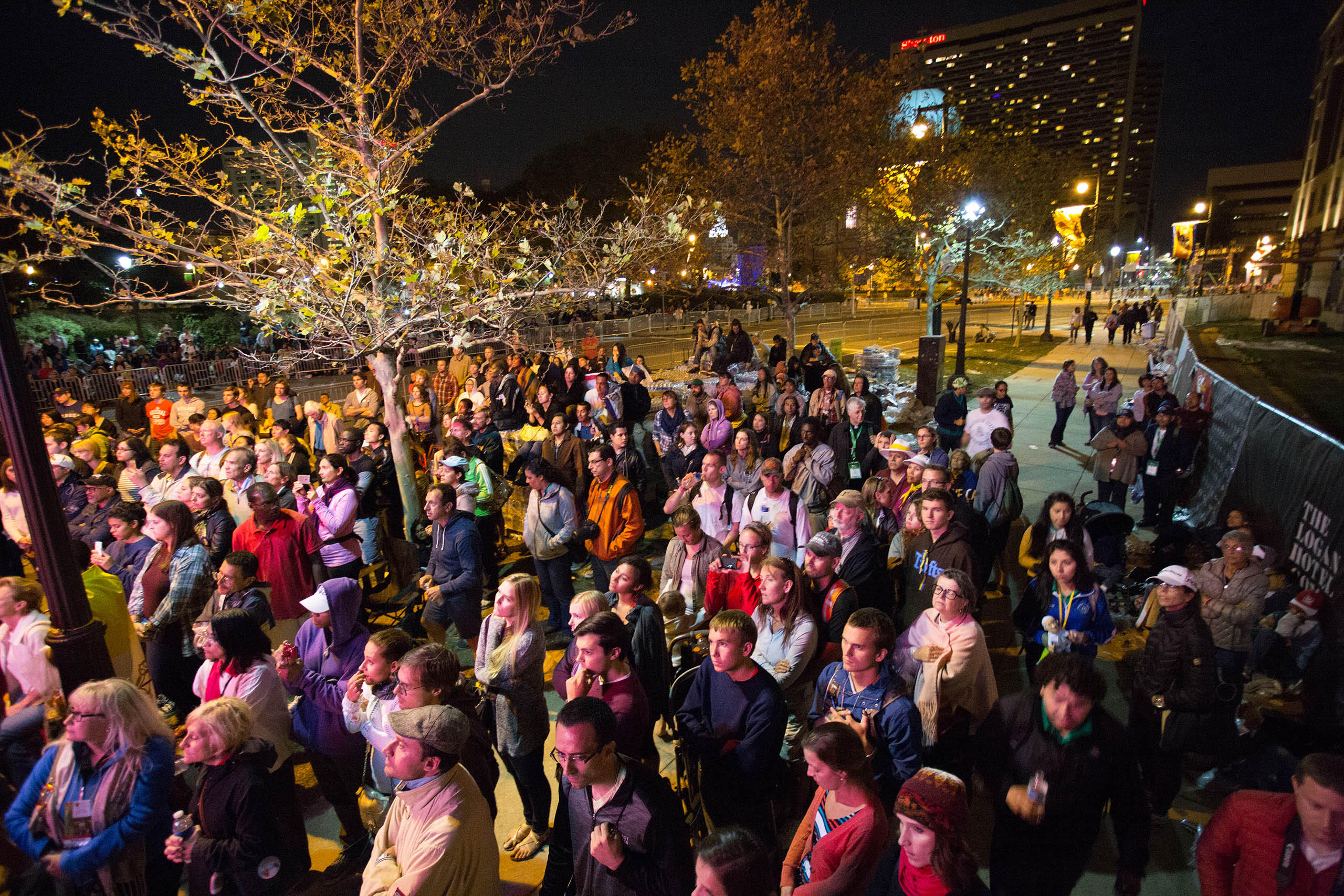 A crowd listens to Pope Francis while he speaks at the World Meeting of Families on Benjamin Franklin Parkway, in Philadelphia, PA. Sept, 26, 2015.
