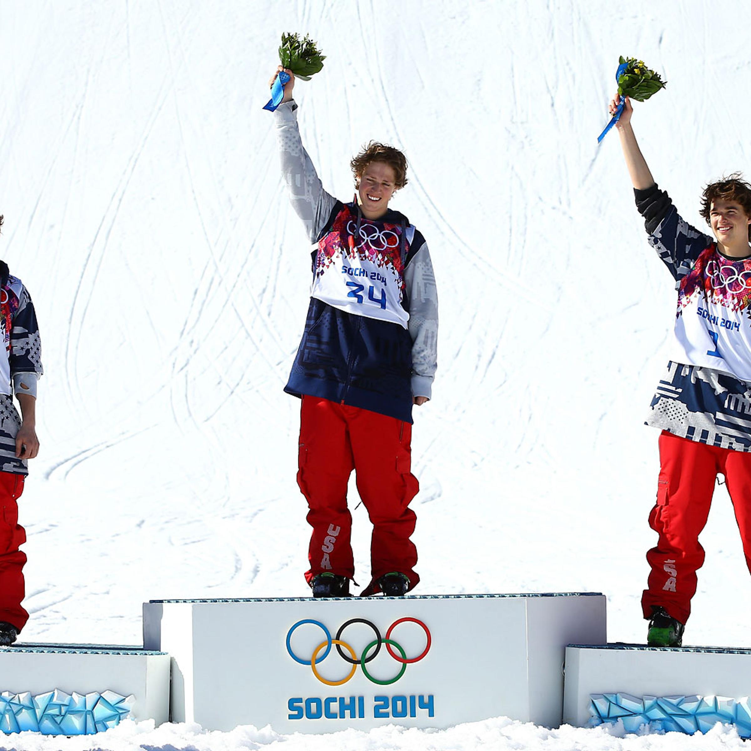 Silver medalist Gus Kenworthy of the United States, gold medalist Joss Christensen of the United States and bronze medalist Nicholas Goepper of the United States stand on the podium during the flower ceremony after the Freestyle Skiing Men's Ski Slopesty