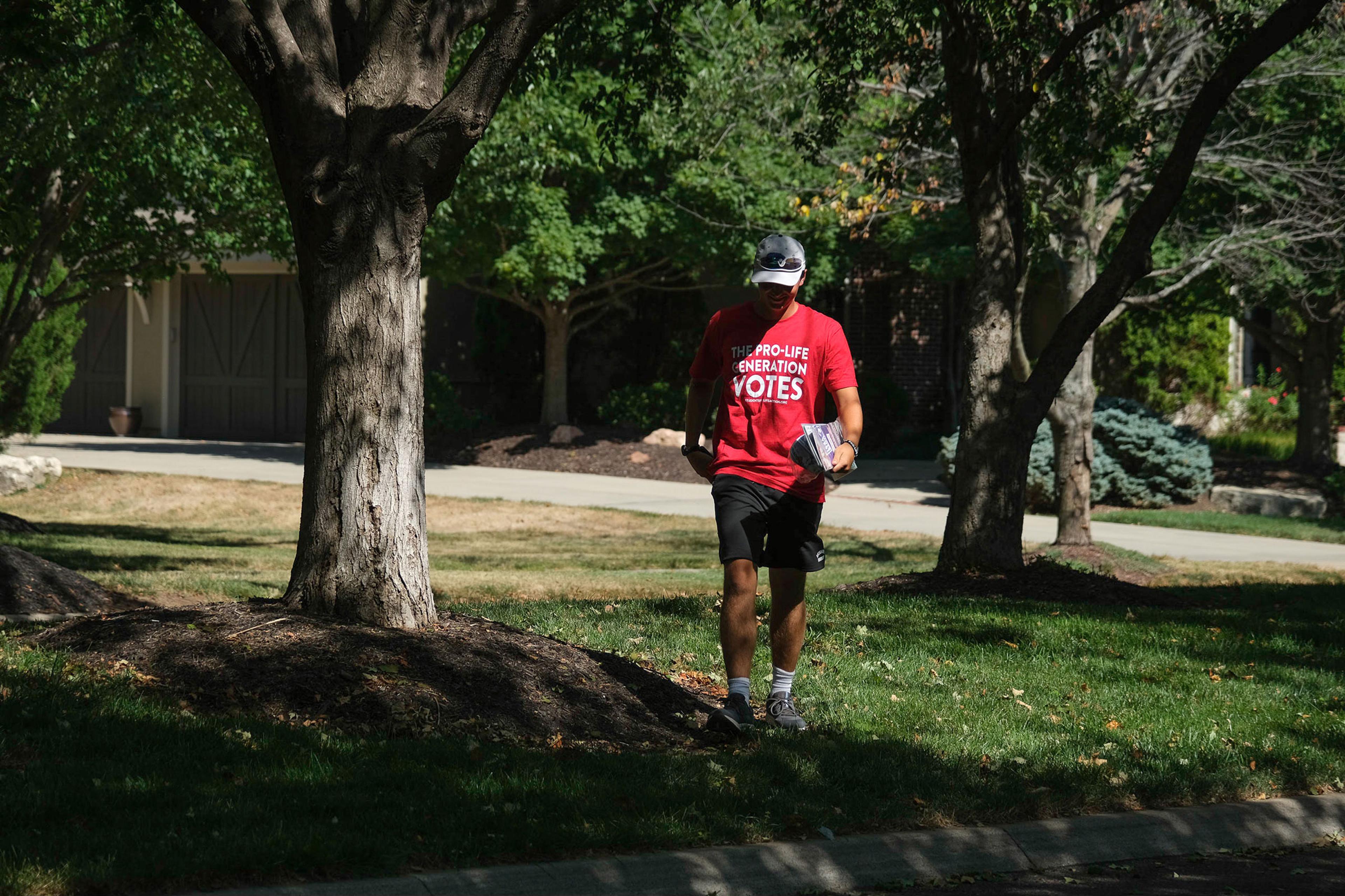 A member of Students for Life canvassed in Overland Park, Kansas on July 23, 2022. Arin Yoon for TIME.