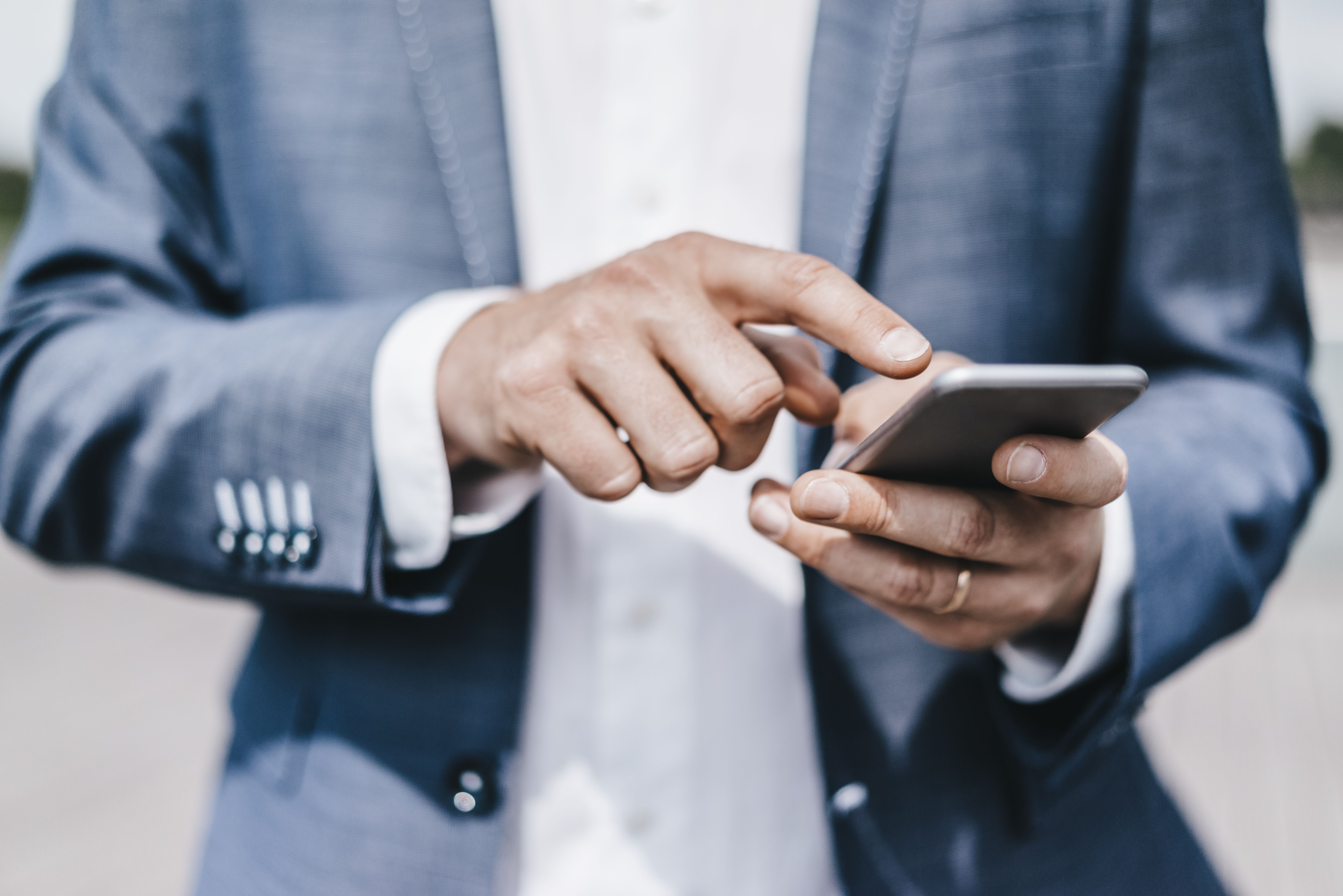 Close-up of businessman using cell phone