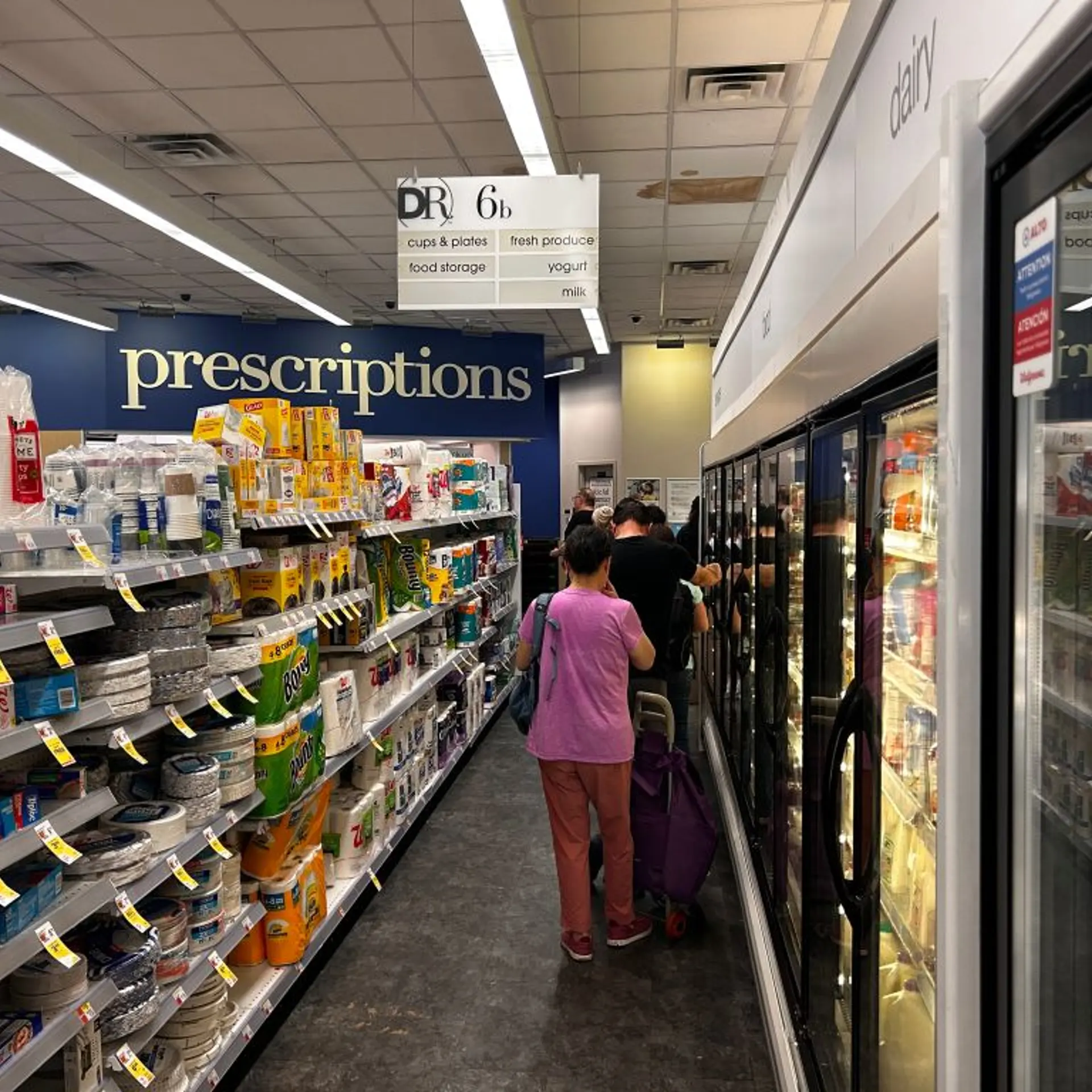 Long line of customers waiting to pick up Prescriptions at Walgreens pharmacy, Queens, New York