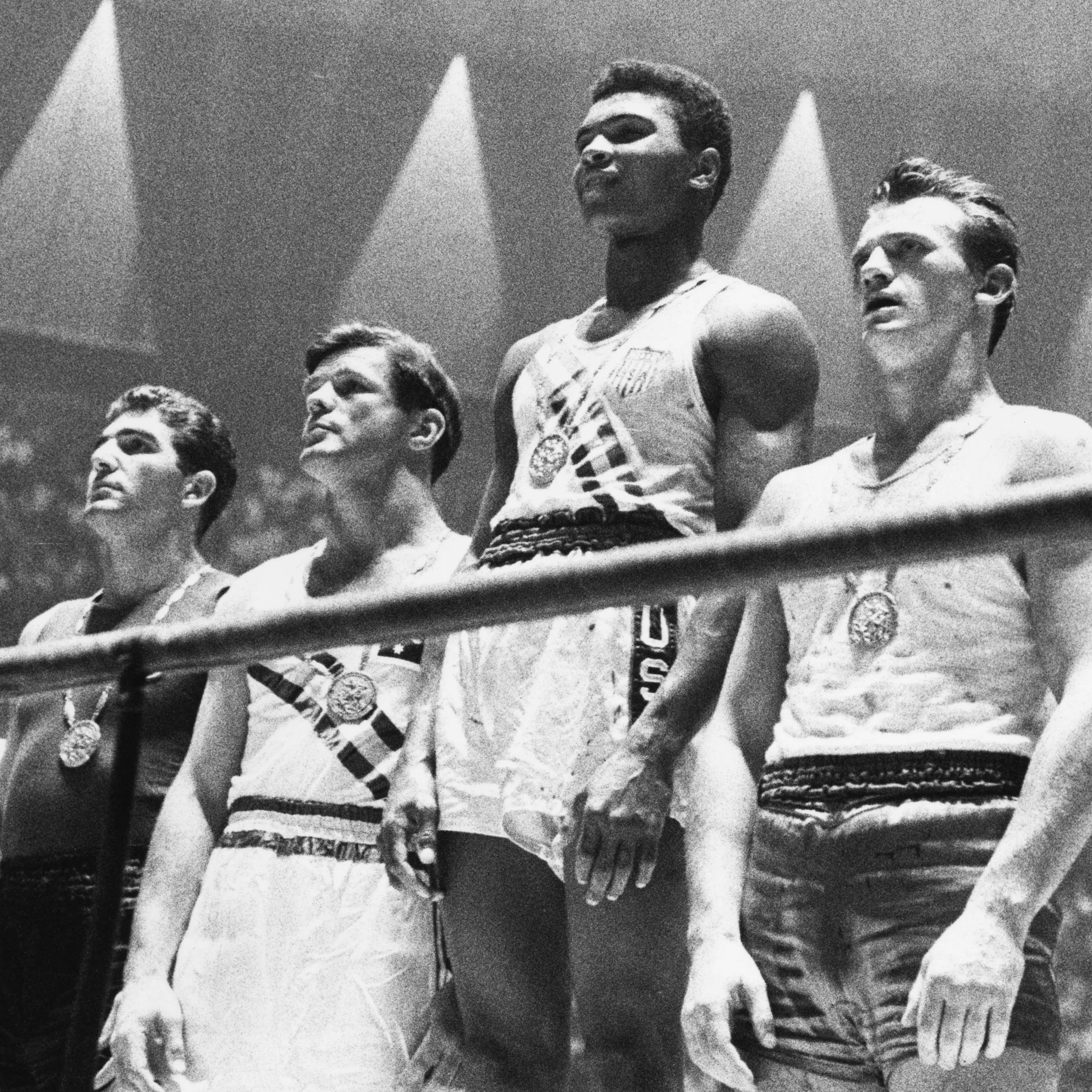 Muhammad Ali, second from right, and the winners of the 1960 Olympic medals for light heavyweight boxing on the winners' podium in Rome.