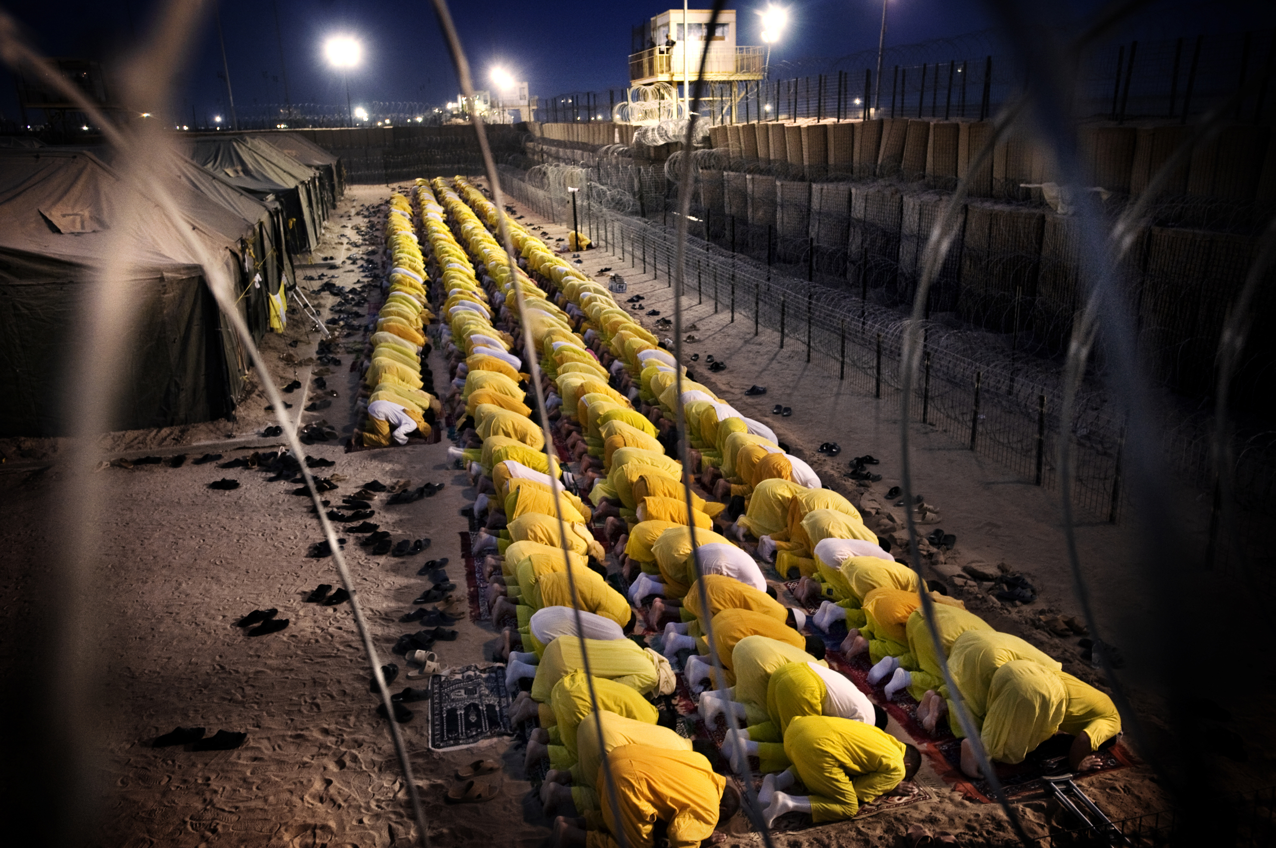 Detainees pray at U.S. military detention facility Camp Bucca, Iraq, March 16, 2009.