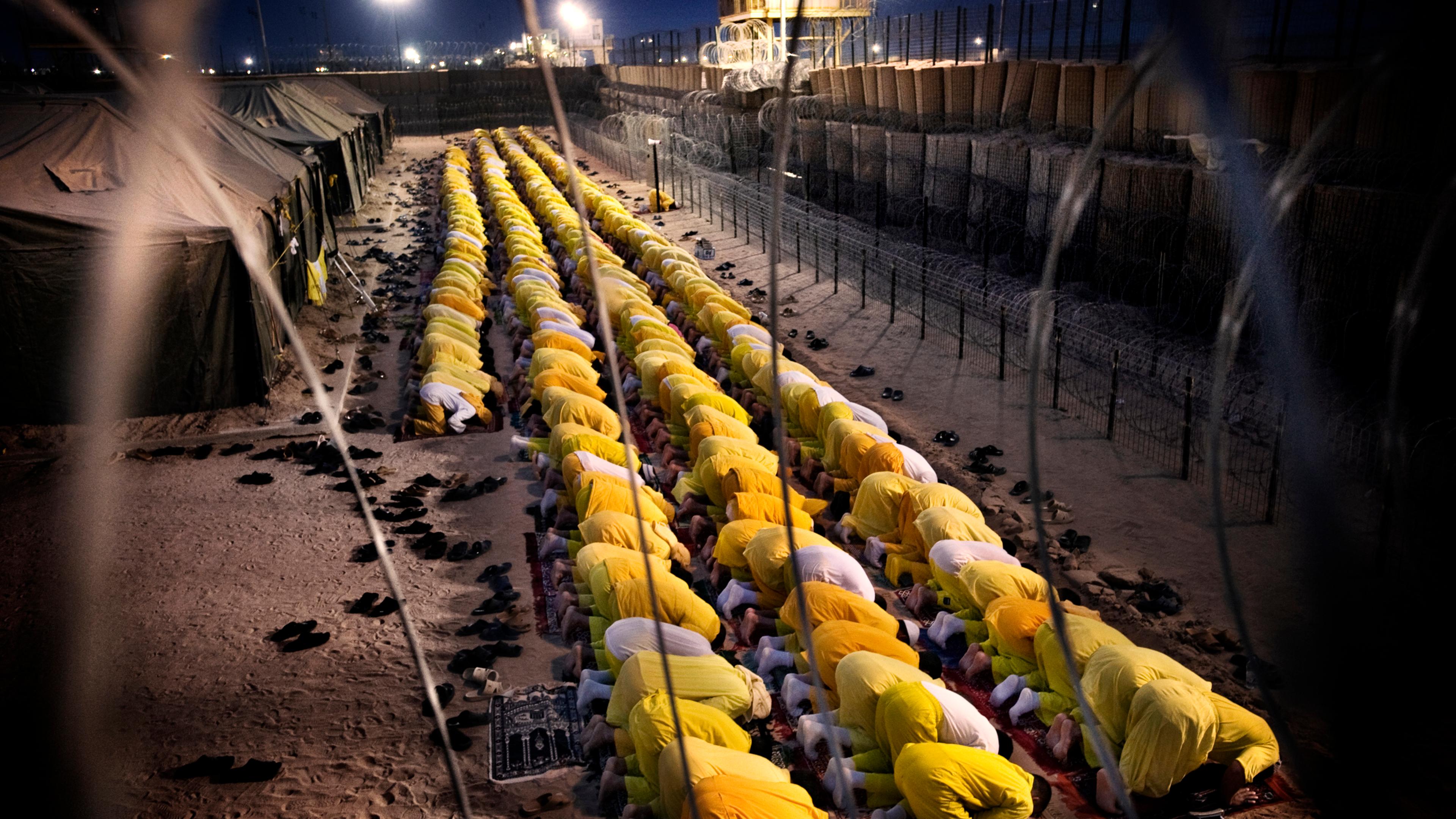 Detainees pray at U.S. military detention facility Camp Bucca, Iraq, March 16, 2009.