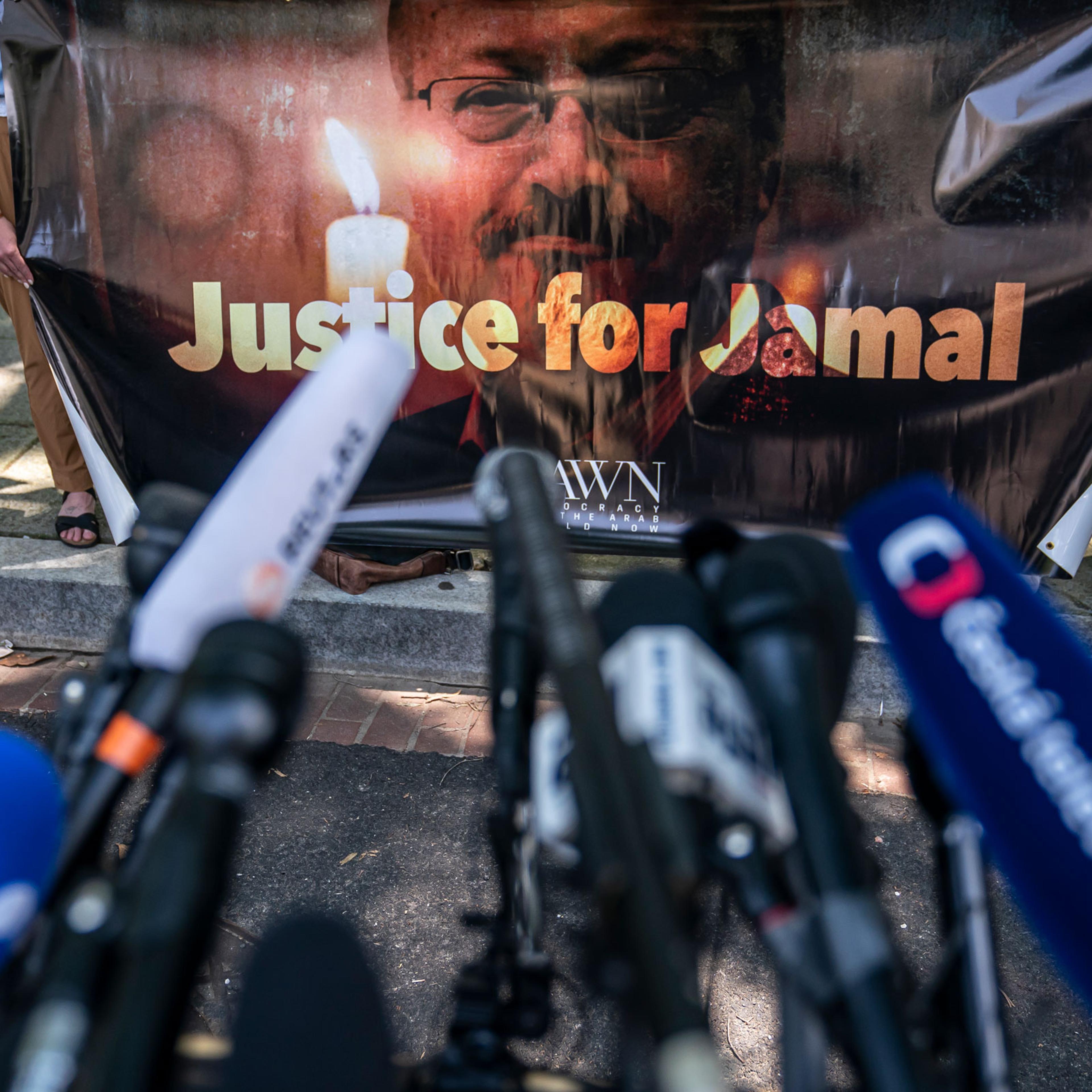 Human rights activists hold a banner calling for justice for the late Jamal Khashoggi