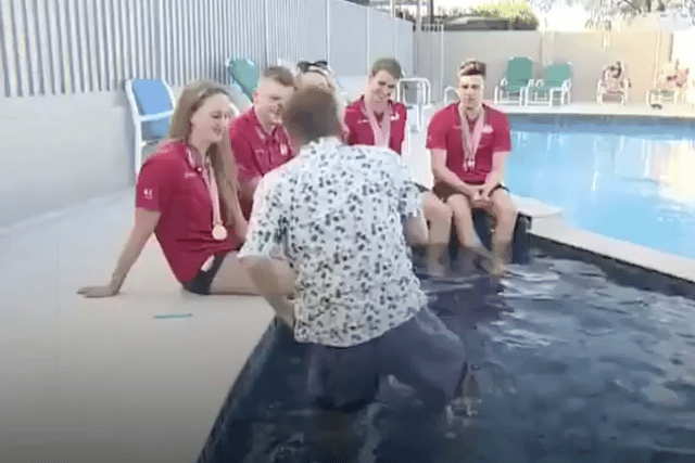Reporter Falls Into Pool on Live TV Interview With Swimmers