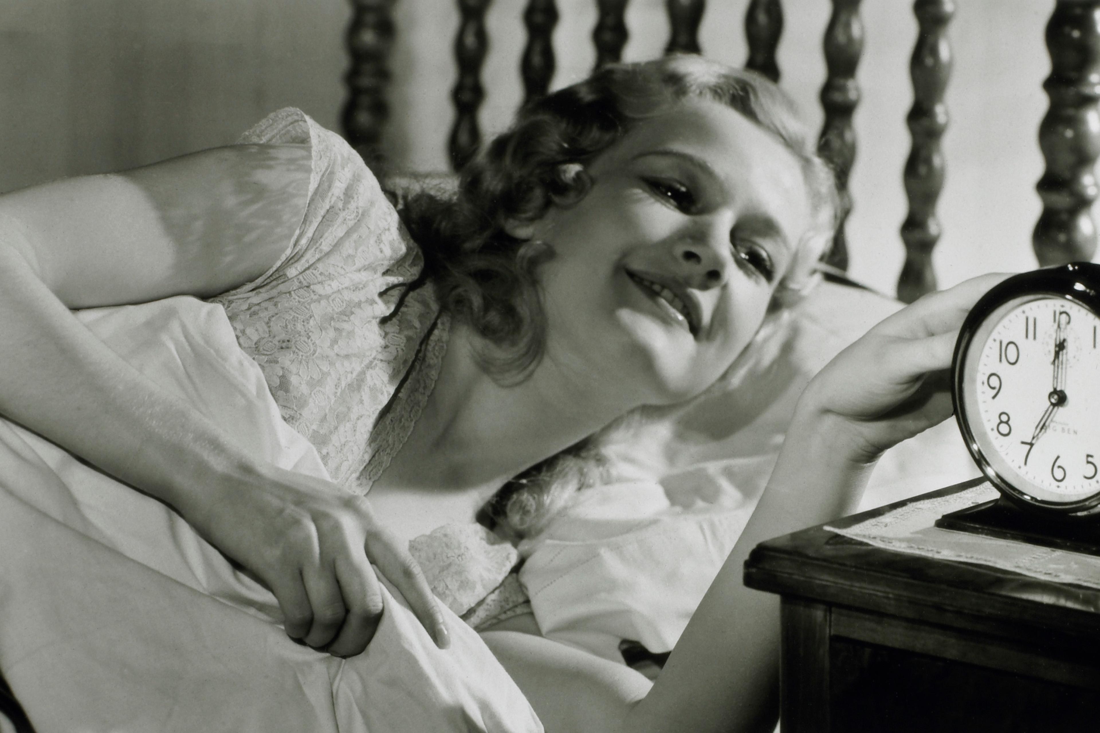 Woman Waking Up Alarm Clock Bed