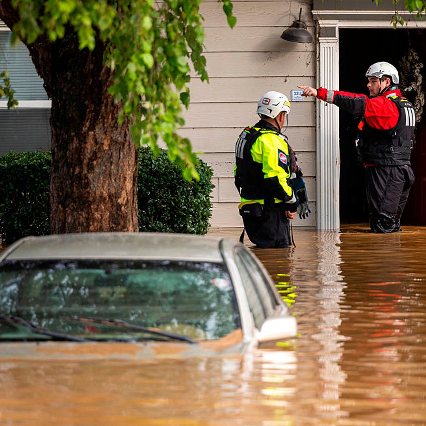 A water rescue unit with the Durham Fire Department knocks on doors at Rippling Streams Townhomes in the Old Farm neighborhood along the Eno River in Durham on Monday morning, July 7, 2025, after flash flooding caused by Tropical Storm Chantal.