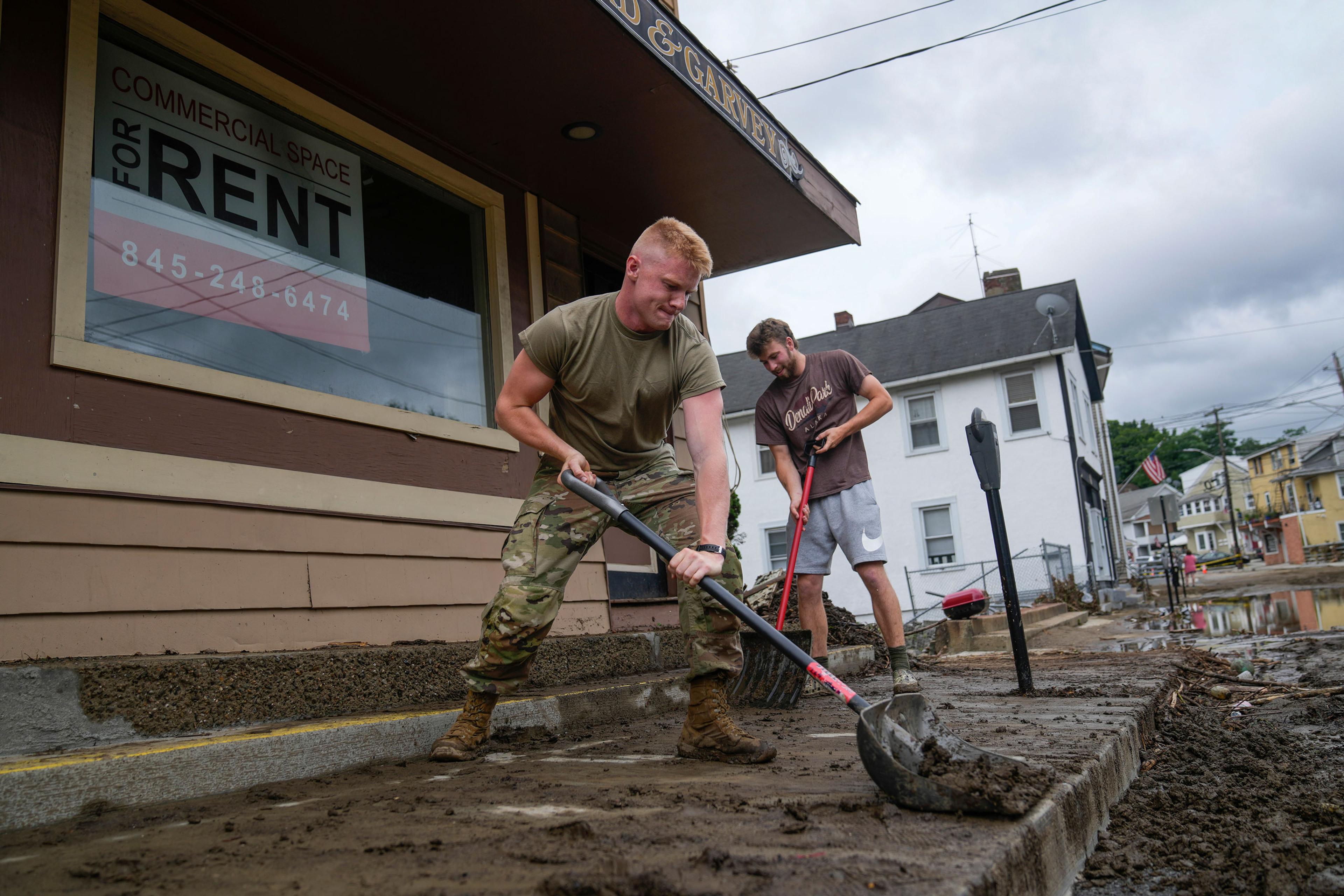 Volunteers help clear Main Street of debris after floodwaters subsided