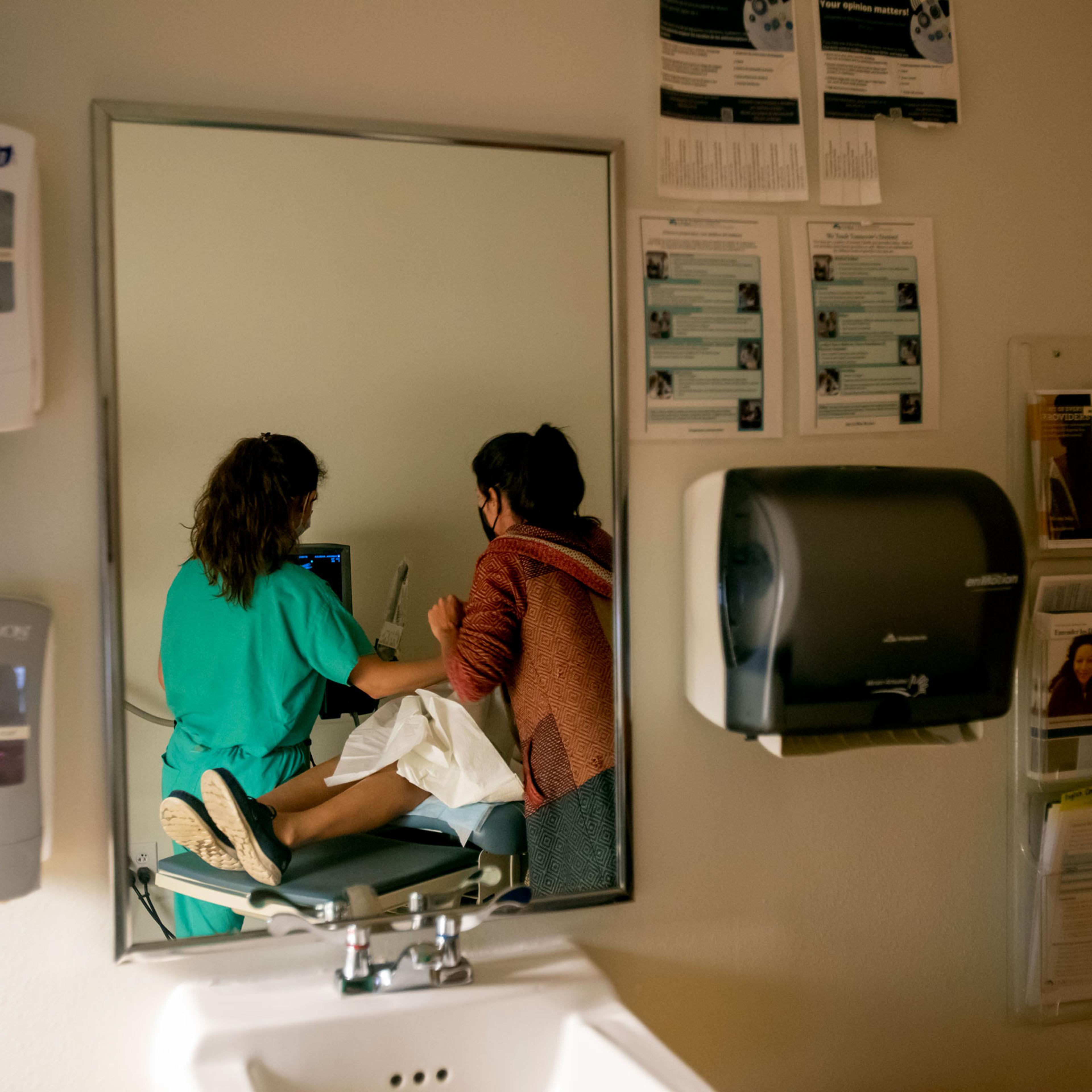 A family physician and her resident perform an ultrasound on a 39-year-old woman who already has four children the day before the Supreme Court overturned Roe v. Wade at the Center for Reproductive Health clinic in Albuquerque, New Mexico, on June 23, 20