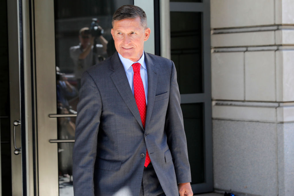 Michael Flynn departs the E. Barrett Prettyman United States Courthouse following a pre-sentencing hearing