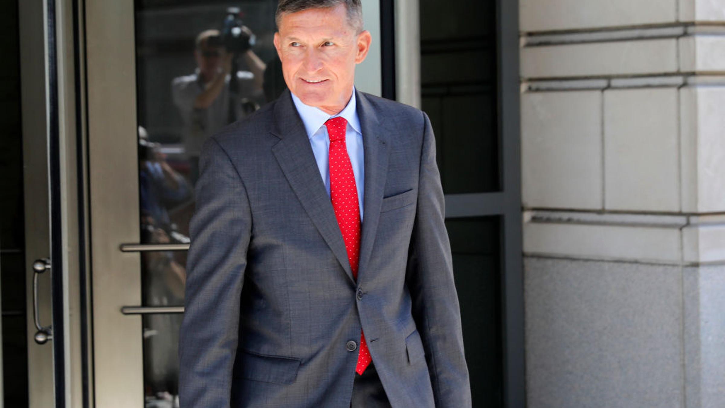Michael Flynn departs the E. Barrett Prettyman United States Courthouse following a pre-sentencing hearing